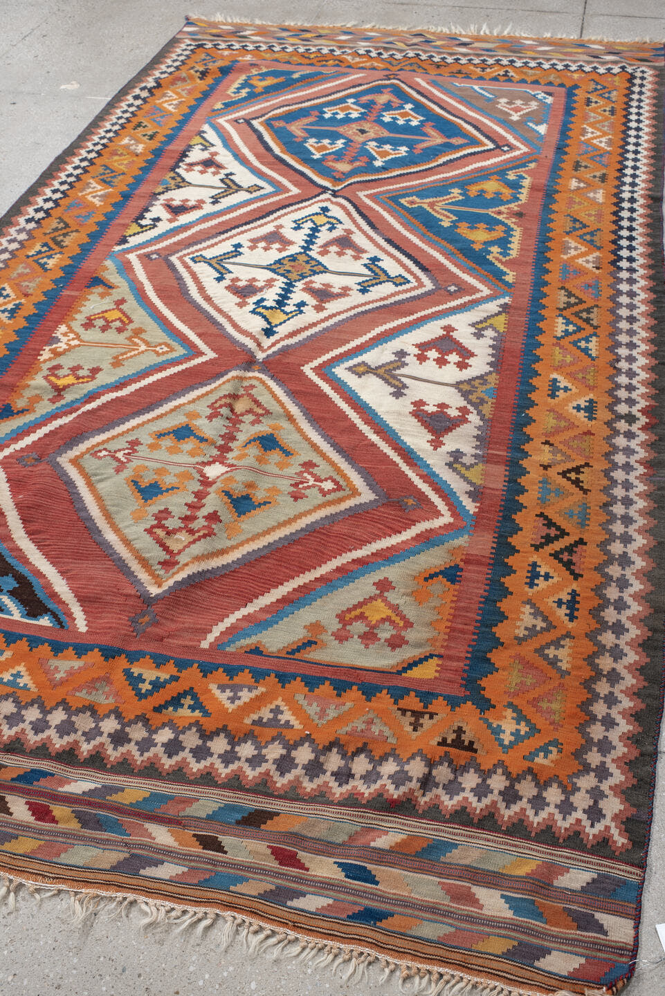 5' x 9' one-of-a-kind handmade vintage Kilim medium size rug. Color palette: terra cotta, ivory, teal, rust, brown, navy