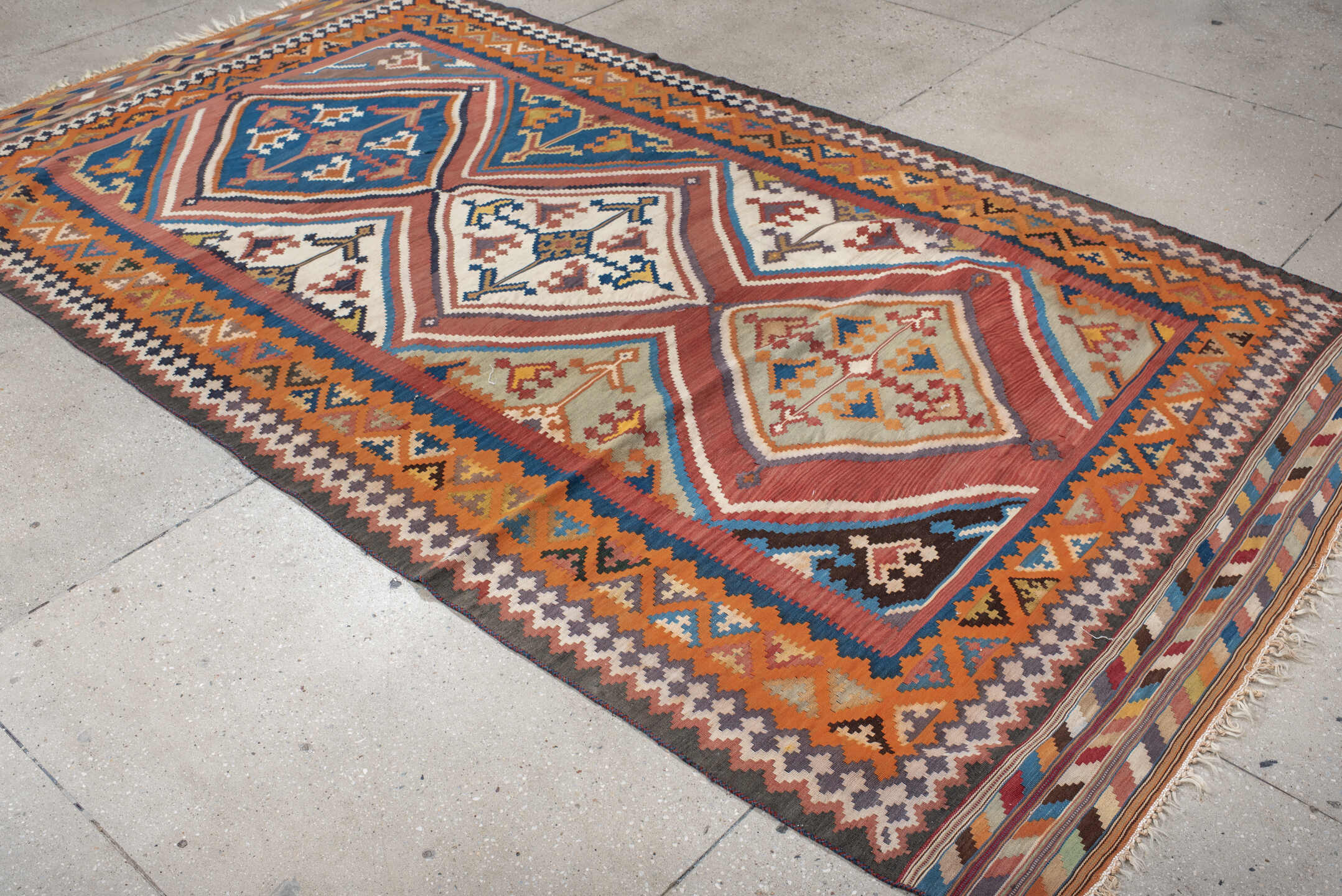5' x 9' one-of-a-kind handmade vintage Kilim medium size rug. Color palette: terra cotta, ivory, teal, rust, brown, navy