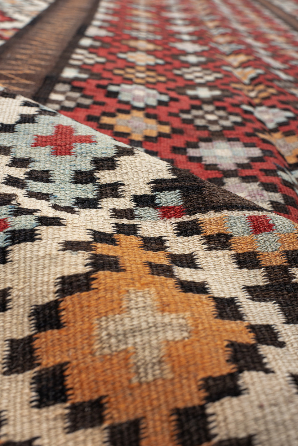 4' x 9' one-of-a-kind handmade vintage Kilim runner rug. Color palette: rust, ivory, charcoal, brown, sky blue, saffron