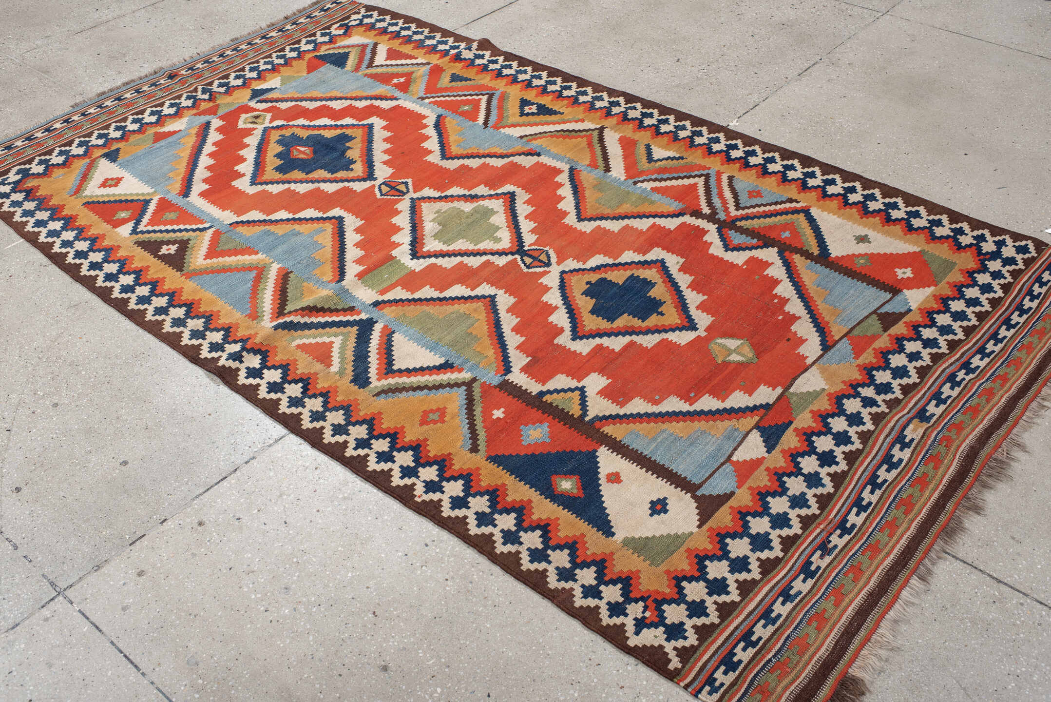 4' x 8' one-of-a-kind handmade vintage Kilim rug. Color palette: rust, ivory, sky_blue, navy, brown, camel, olive, coral