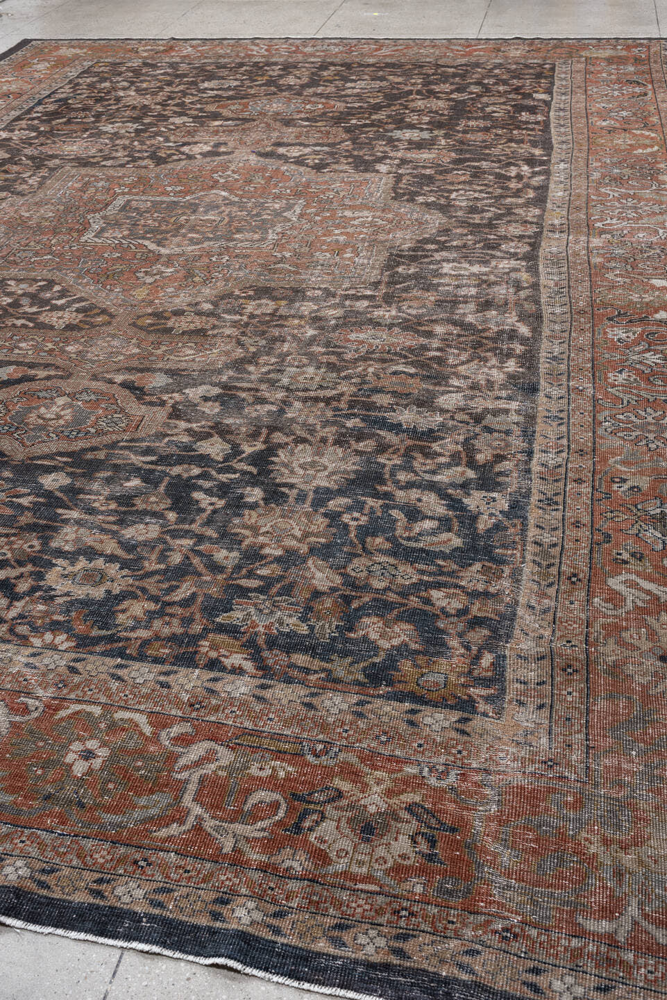 12' x 17' one-of-a-kind handmade antique Mahal oversize rug. Color palette: charcoal, rust, ivory, taupe, slate, camel, sage