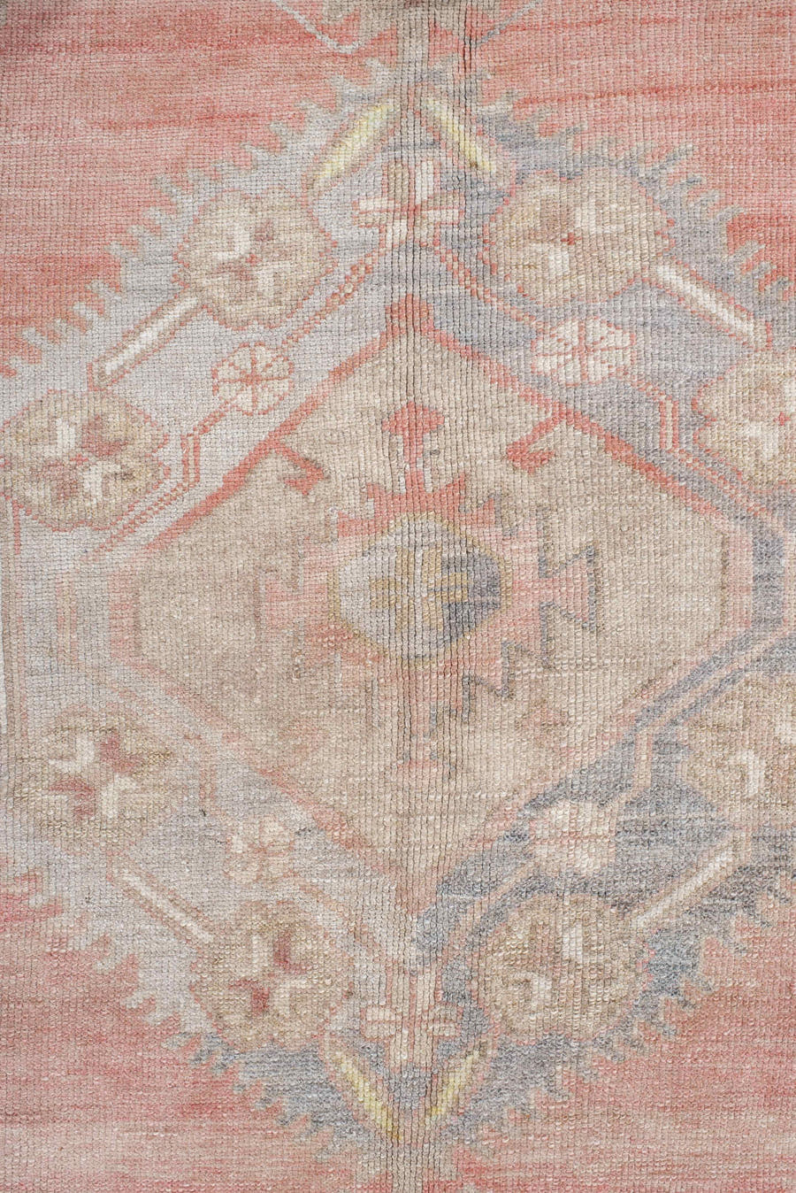 5' x 9' one-of-a-kind handmade antique Anatolian medium size rug. Color palette: ivory, coral, taupe, slate, sage, ochre