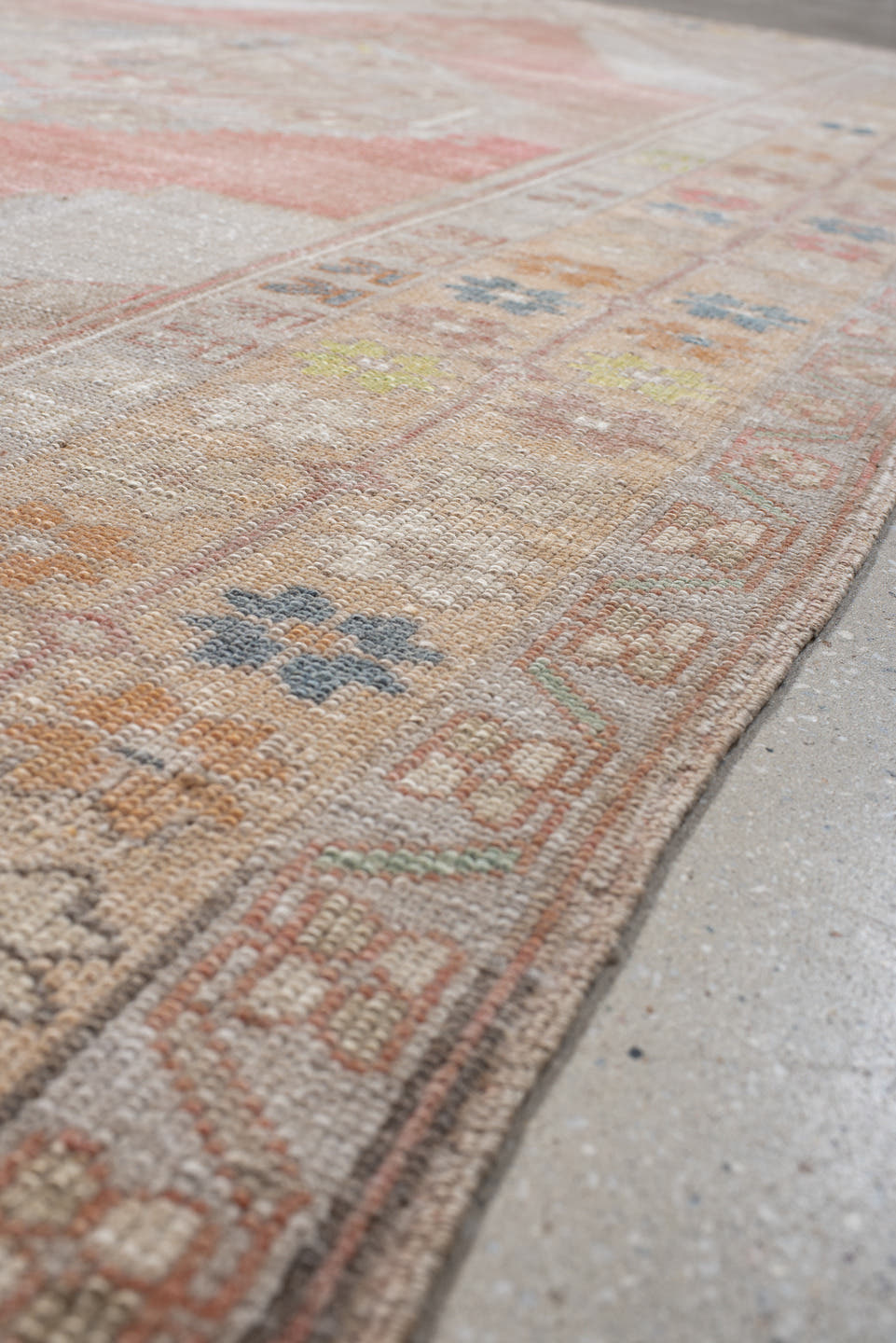 5' x 9' one-of-a-kind handmade antique Anatolian medium size rug. Color palette: ivory, coral, taupe, slate, sage, ochre