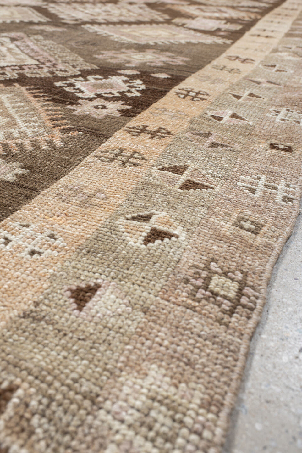 4' x 11' one-of-a-kind handmade vintage Kars runner rug. Color palette: brown, taupe, ivory, blush, beige, camel, charcoal