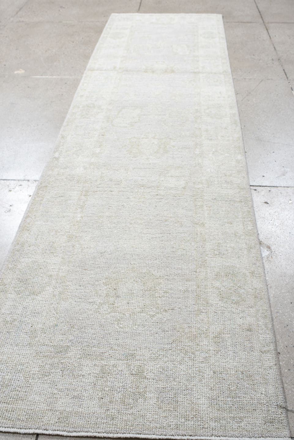 2' x 9' one-of-a-kind handmade antique Oushak runner rug. Color palette: ivory, cream, taupe, beige, pale sage, gray, green