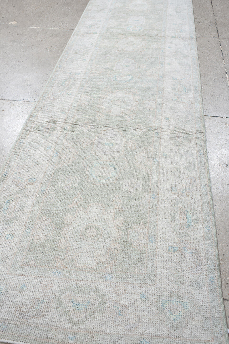 2' x 10' one-of-a-kind handmade vintage Oushak runner rug. Color palette: ivory, pale blue, cream, light gray, light blue