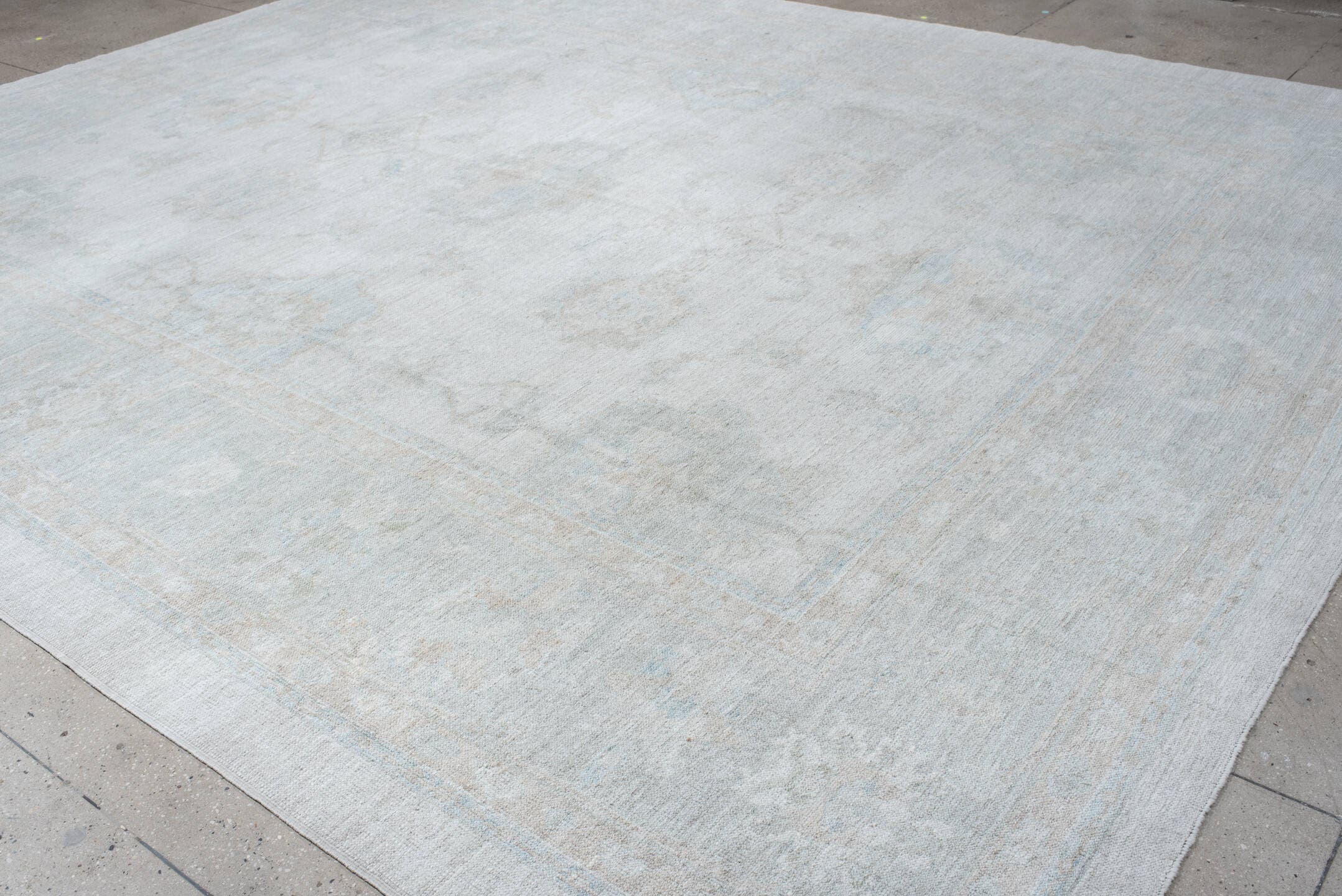 12' x 15' one-of-a-kind handmade vintage Oushak oversize rug. Color palette: ivory, pale blue, taupe, cream, sage
