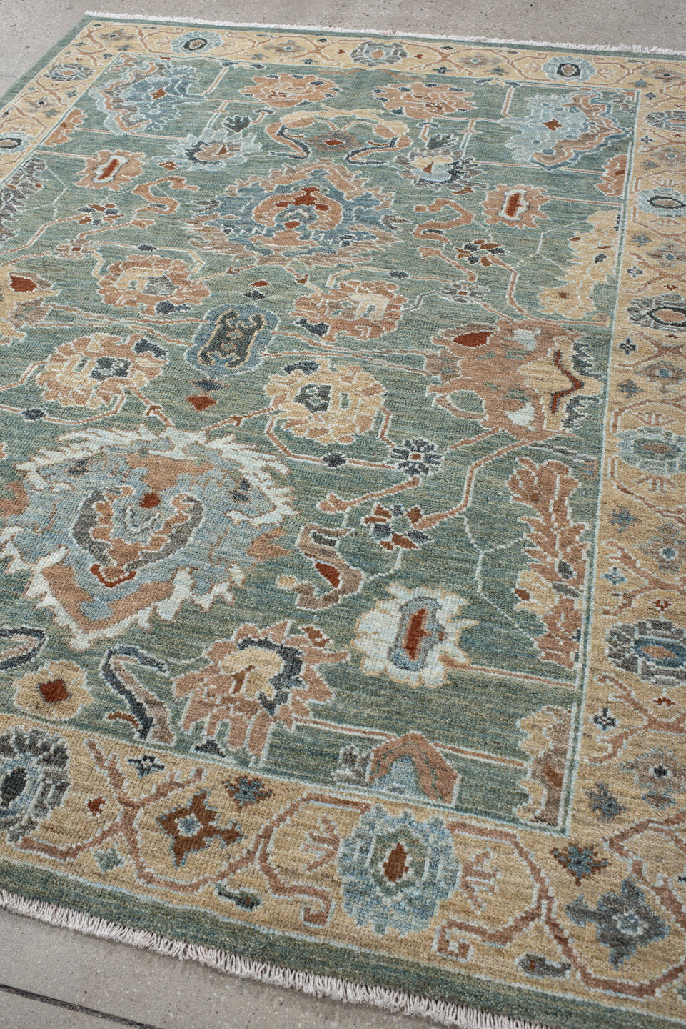 5' x 7' one-of-a-kind handmade vintage Sultanabad rug. Color palette: sage, ivory, peach, slate, rust, cream, charcoal