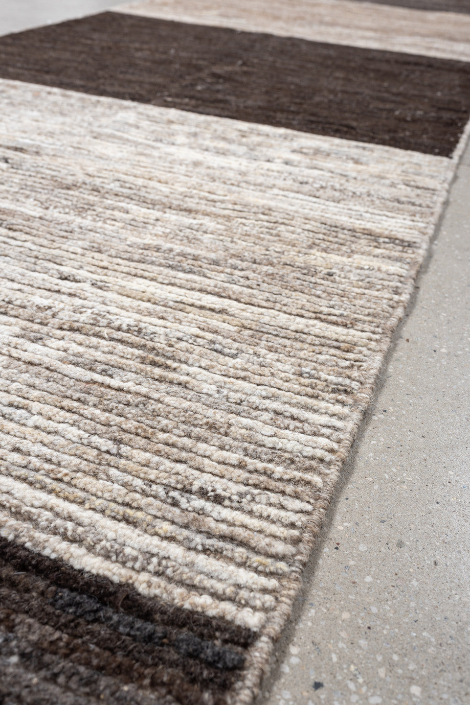 3' x 12' one-of-a-kind handmade vintage Tulu runner rug. Color palette: charcoal, taupe, ivory, brown, cream, slate, black