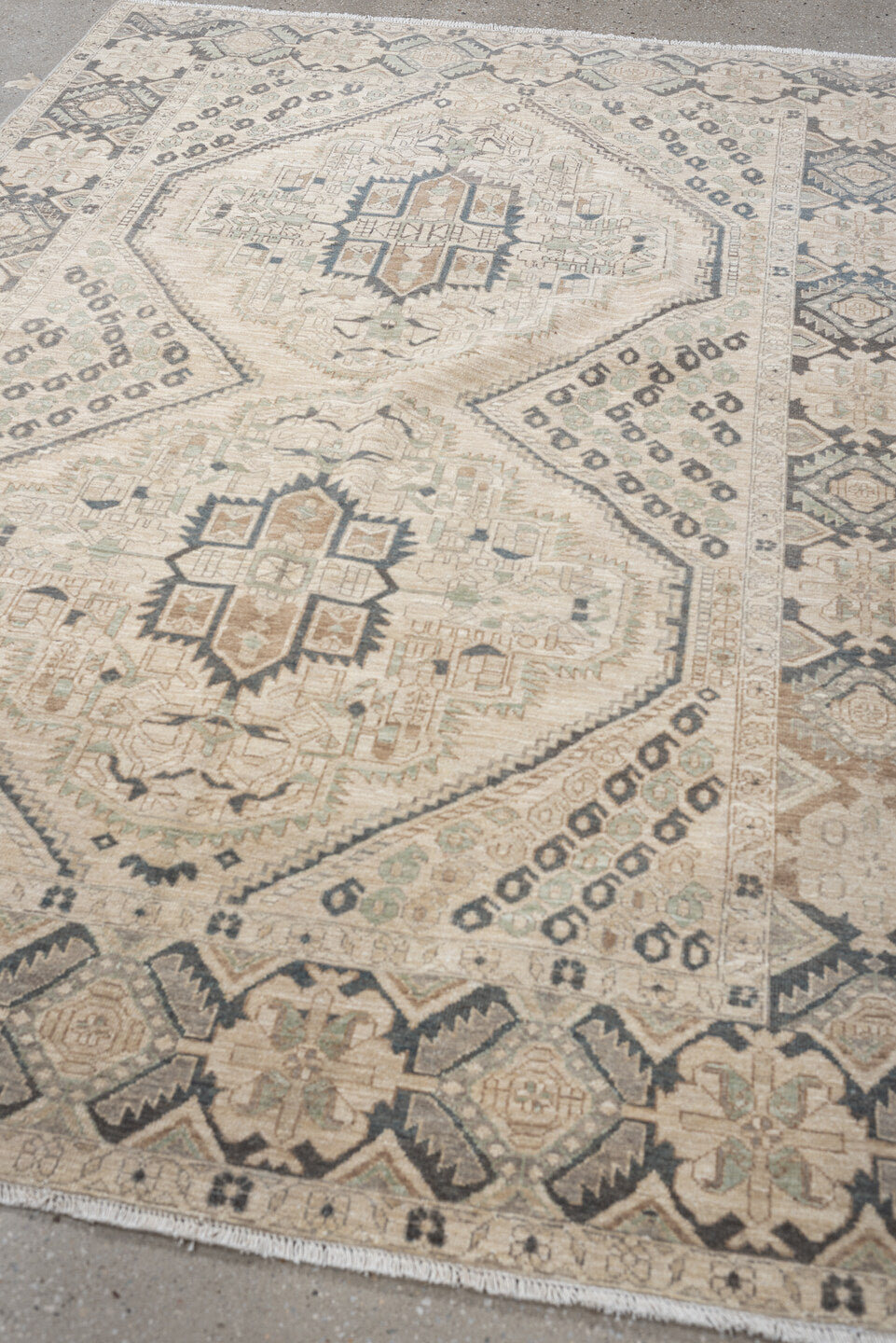 5' x 7' one-of-a-kind handmade vintage Afshar rug. Color palette: ivory, charcoal, sage, sand, taupe, camel, black, gray