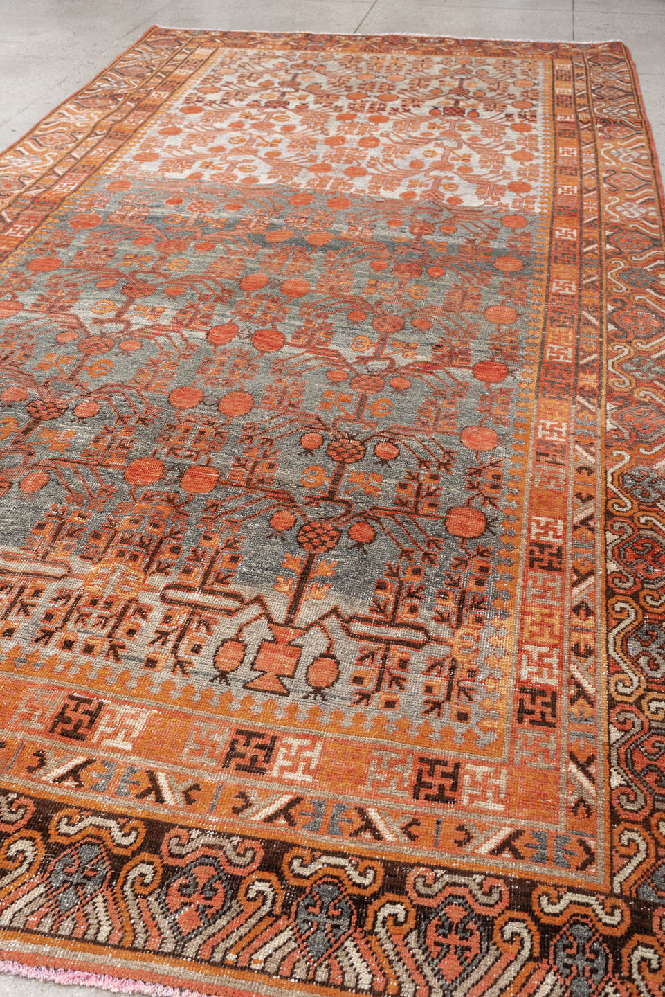 6' x 13' one-of-a-kind handmade antique Khotan large size rug. Color palette: slate, terra cotta, rust, ivory, charcoal