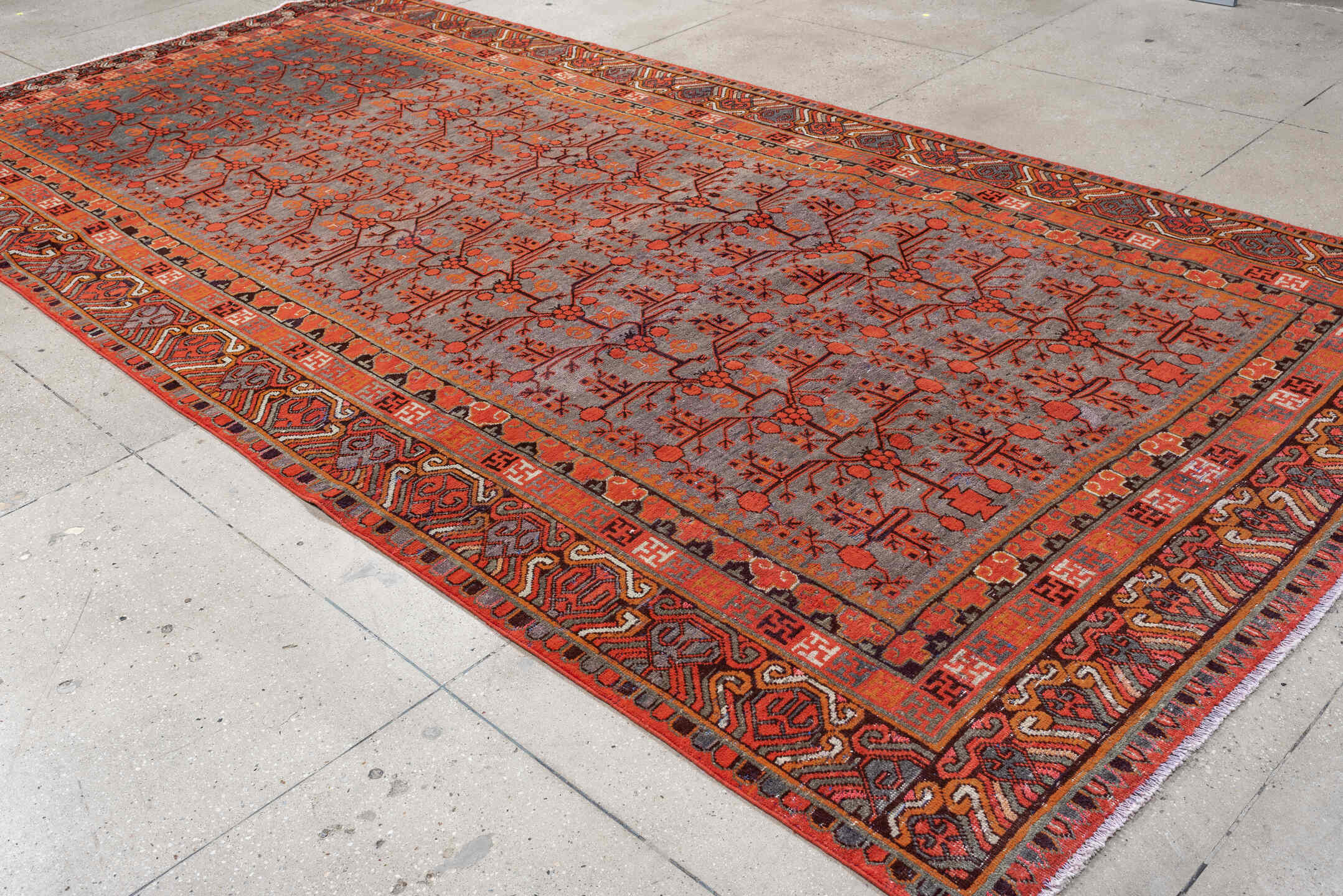 6' x 14' one-of-a-kind handmade antique Khotan large size rug. Color palette: slate, terracotta, rust, ivory, charcoal