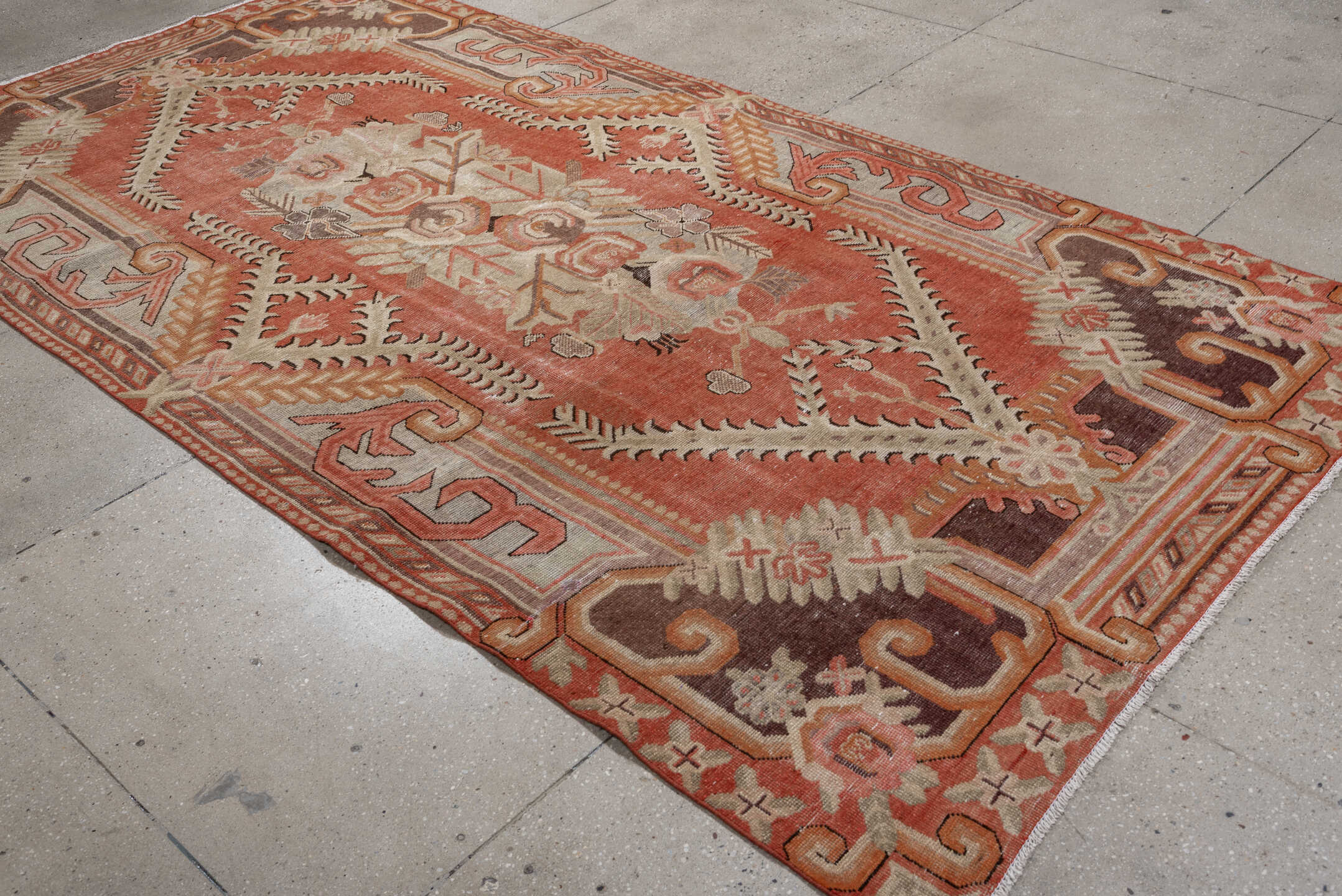 5' x 10' one-of-a-kind handmade antique Khotan large size rug. Color palette: coral, ivory, taupe, chocolate_brown, peach