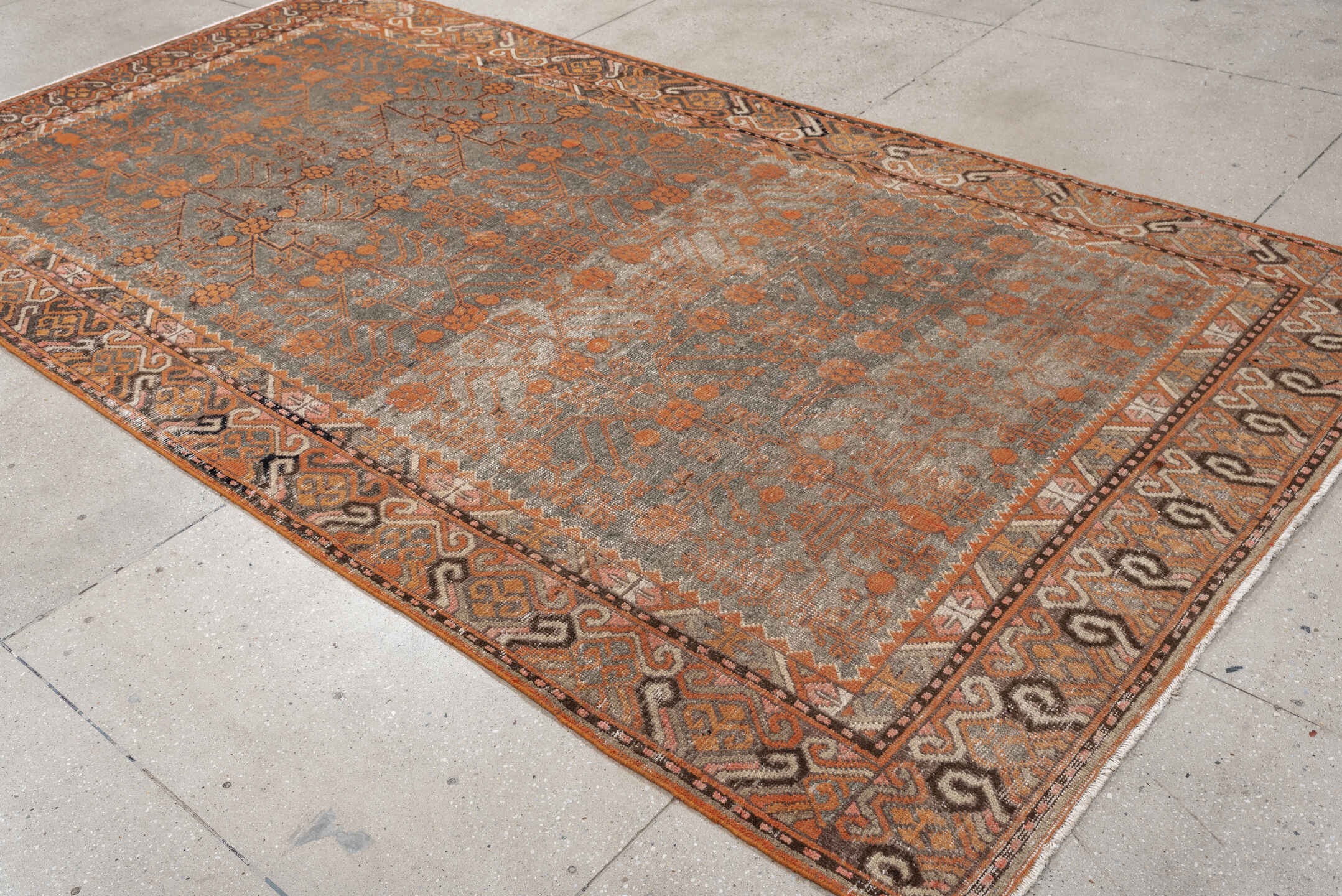 5' x 11' one-of-a-kind handmade antique Khotan large size rug. Color palette: taupe, terra cotta, charcoal, ivory, camel