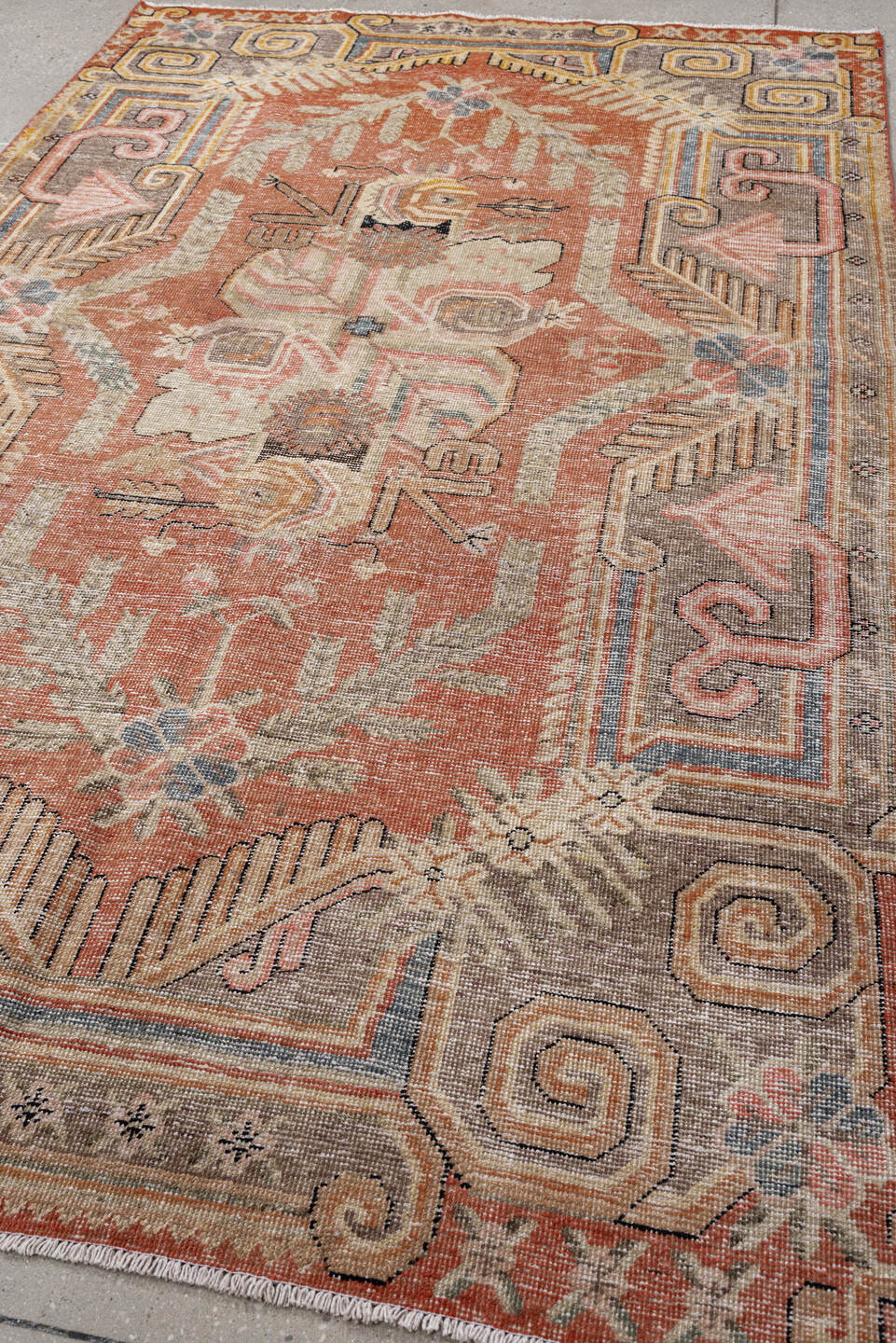 5' x 8' one-of-a-kind handmade vintage Khotan medium size rug. Color palette: terra cotta, ivory, taupe, slate, blush, camel