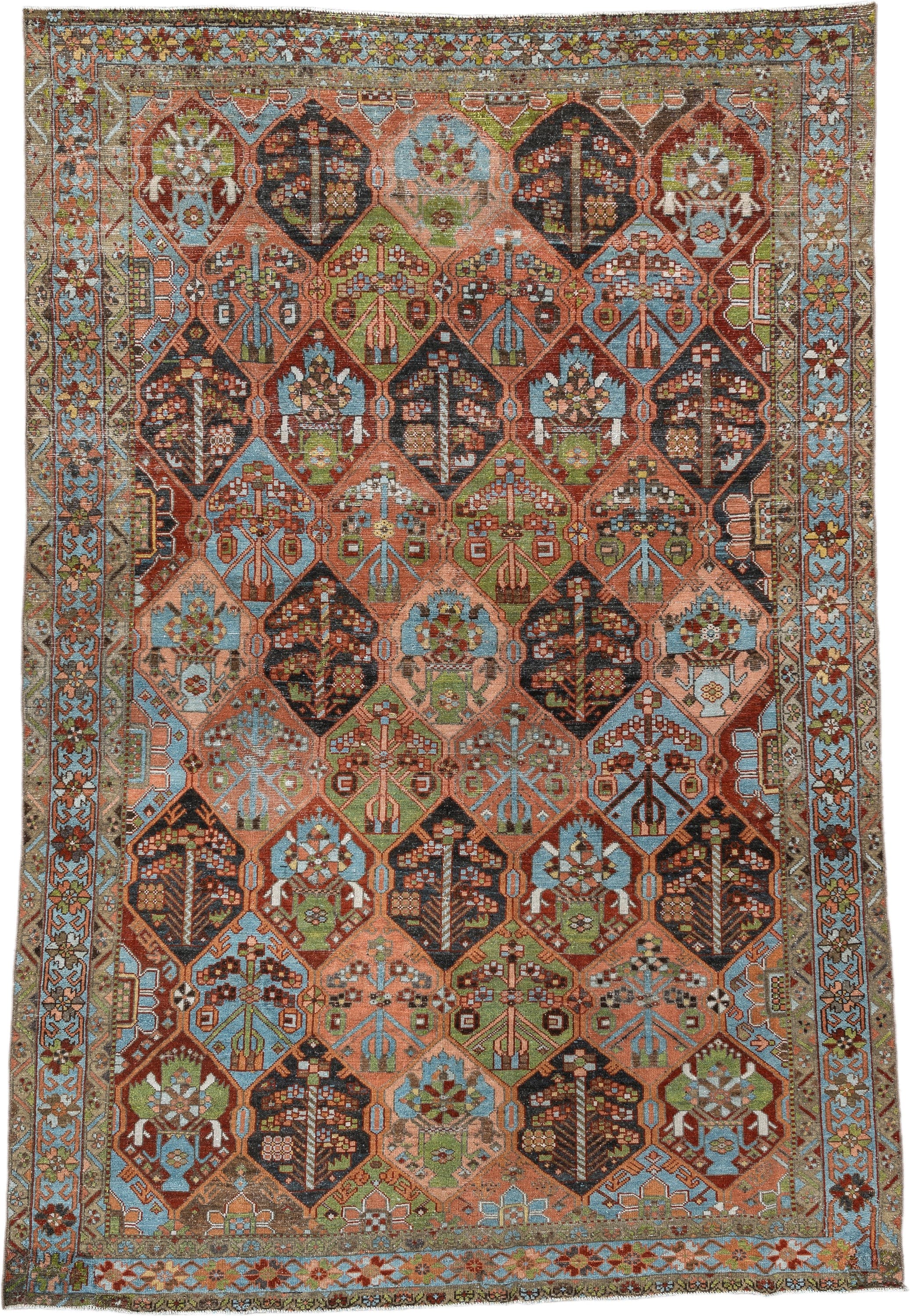 6' x 9' one-of-a-kind handmade antique Baktiary large size rug. Color palette: terra cotta, sky blue, olive, ivory, navy