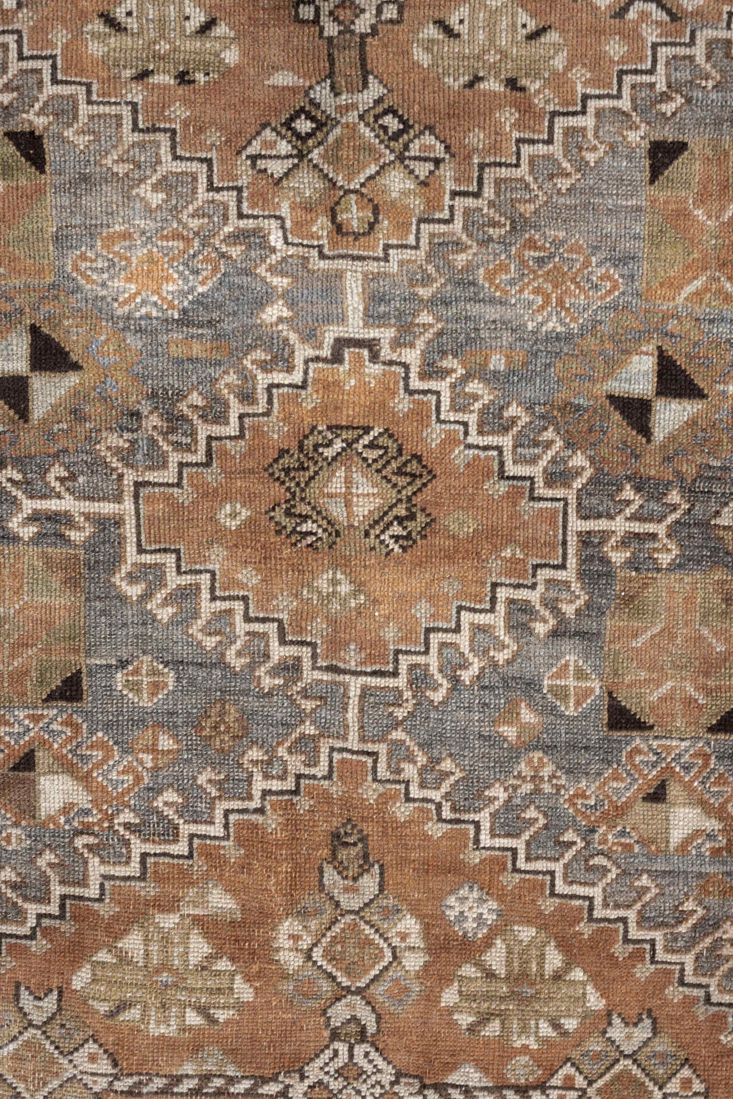 4' x 6' one-of-a-kind handmade antique Shiraz rug. Color palette: terra cotta, sage, ivory, charcoal, taupe, slate, camel