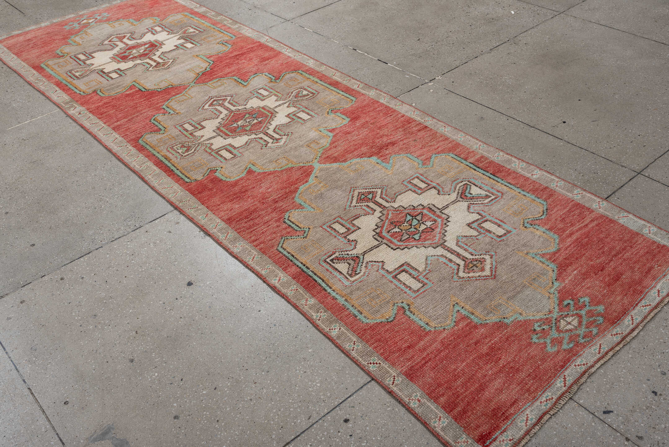 2' x 10' one-of-a-kind handmade vintage runner rug. Color palette: terracotta, ivory, taupe, aqua, rust, sage, brown, beige