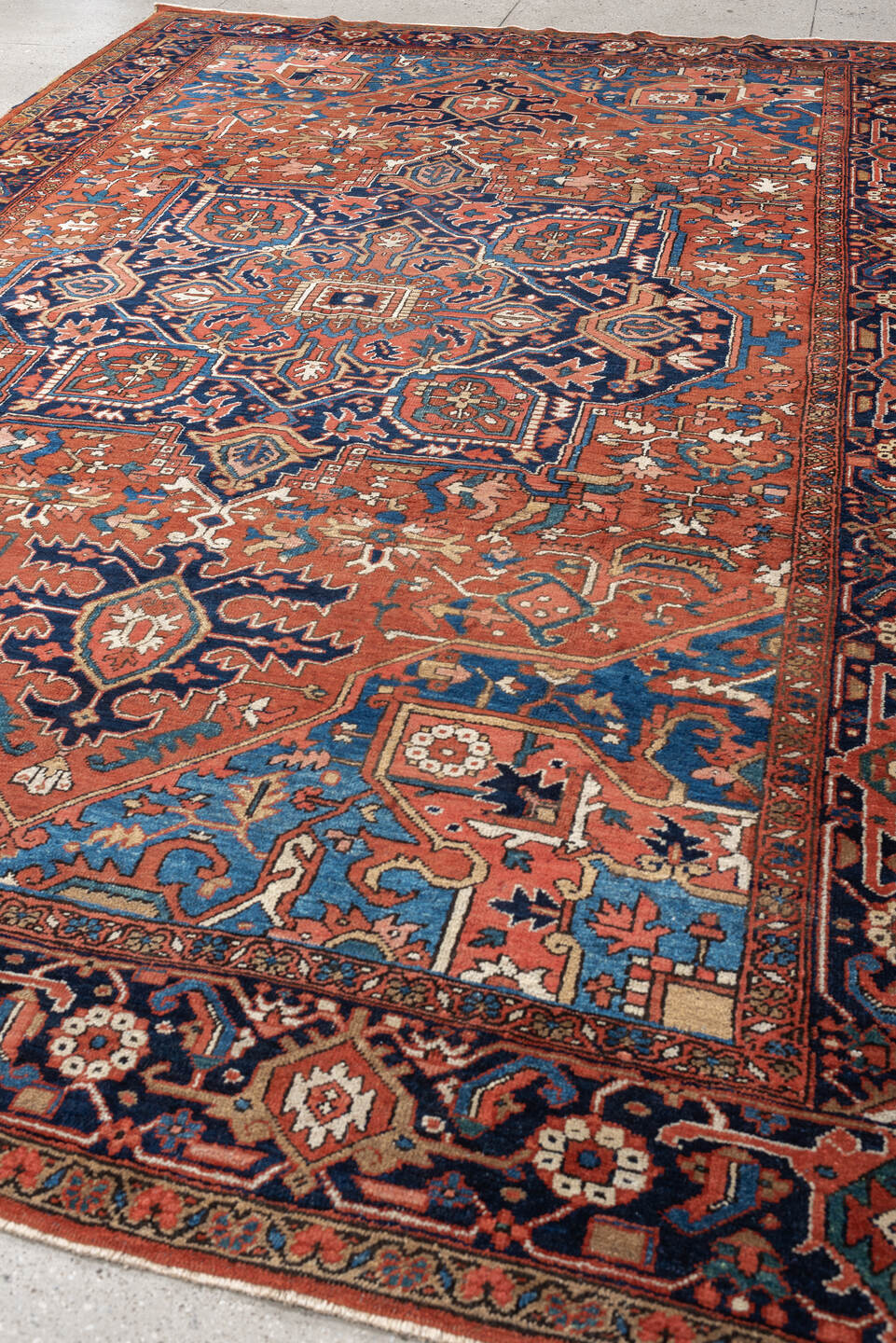 8' x 12' one-of-a-kind handmade vintage Heriz large size rug. Color palette: terracotta, navy, sky blue, ivory, camel, rust