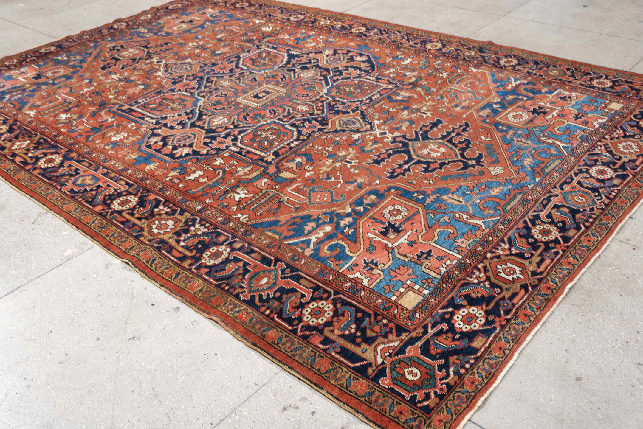 8' x 12' one-of-a-kind handmade vintage Heriz large size rug. Color palette: terracotta, navy, sky blue, ivory, camel, rust