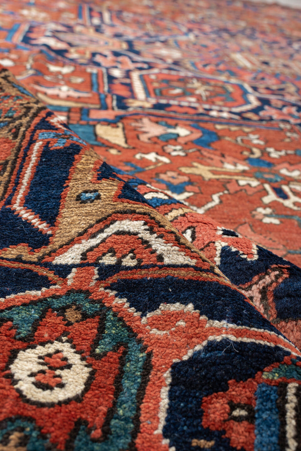 8' x 12' one-of-a-kind handmade vintage Heriz large size rug. Color palette: terracotta, navy, sky blue, ivory, camel, rust