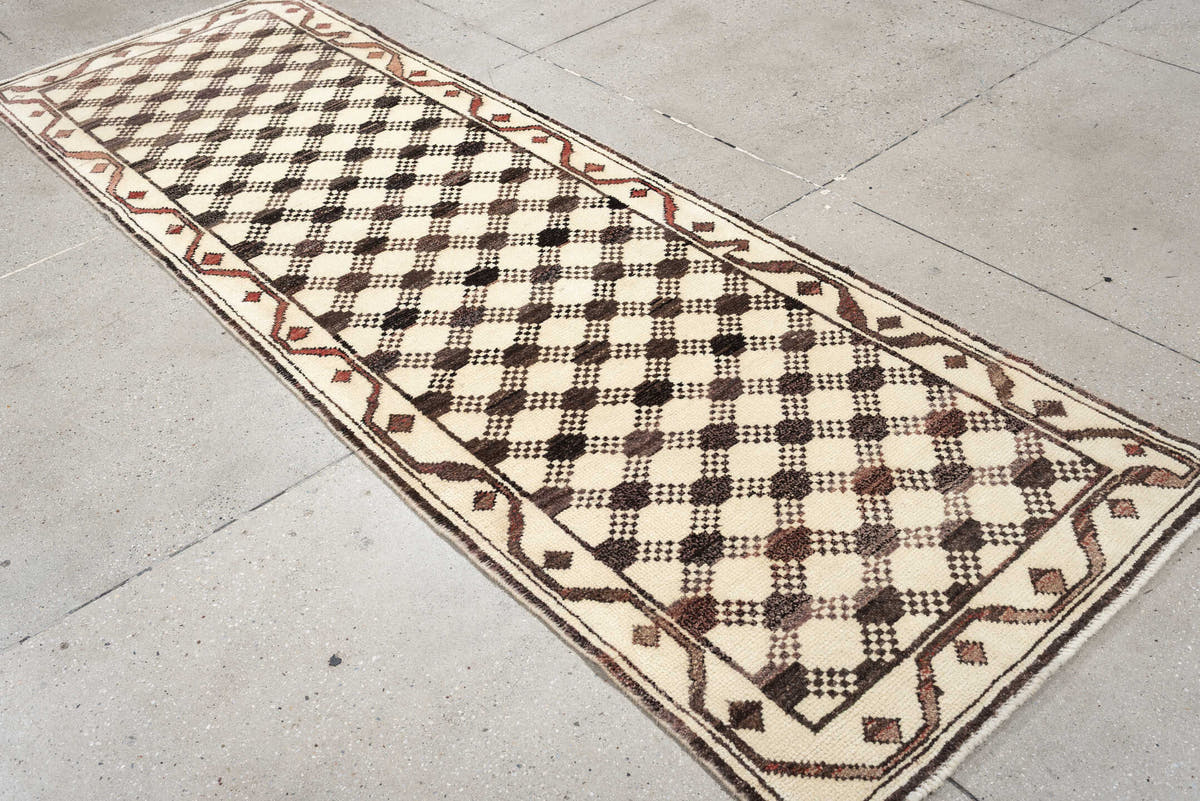 3' x 9' one-of-a-kind handmade vintage Kars runner rug. Color palette: ivory, brown, taupe, muted rose, charcoal, terracotta
