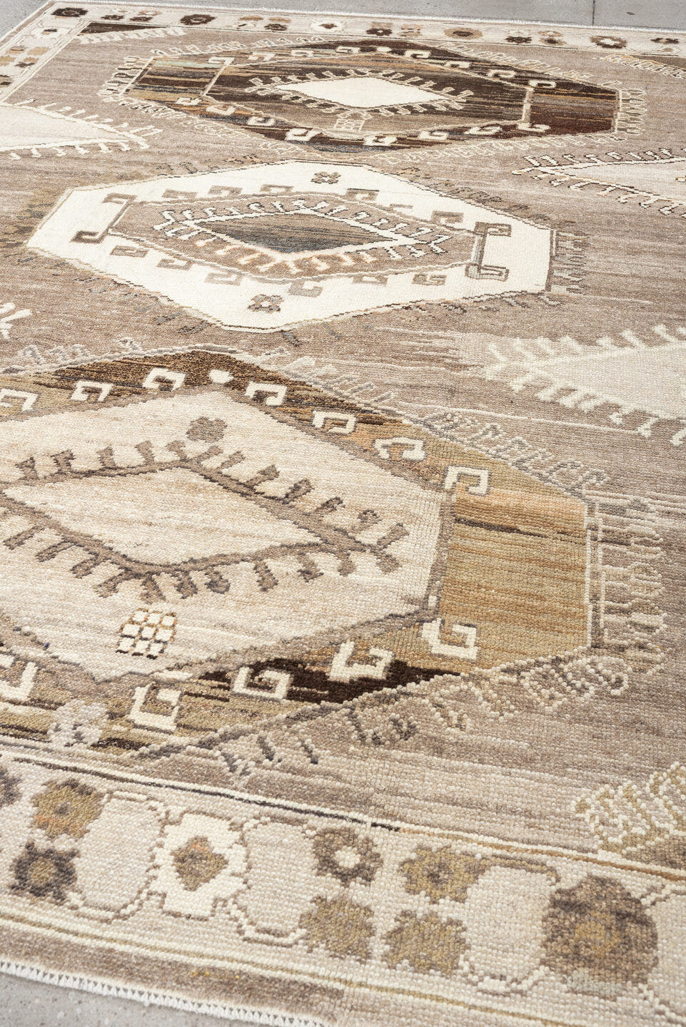 7' x 10' one-of-a-kind handmade vintage Kars large size rug. Color palette: taupe, ivory, brown, charcoal, camel, beige