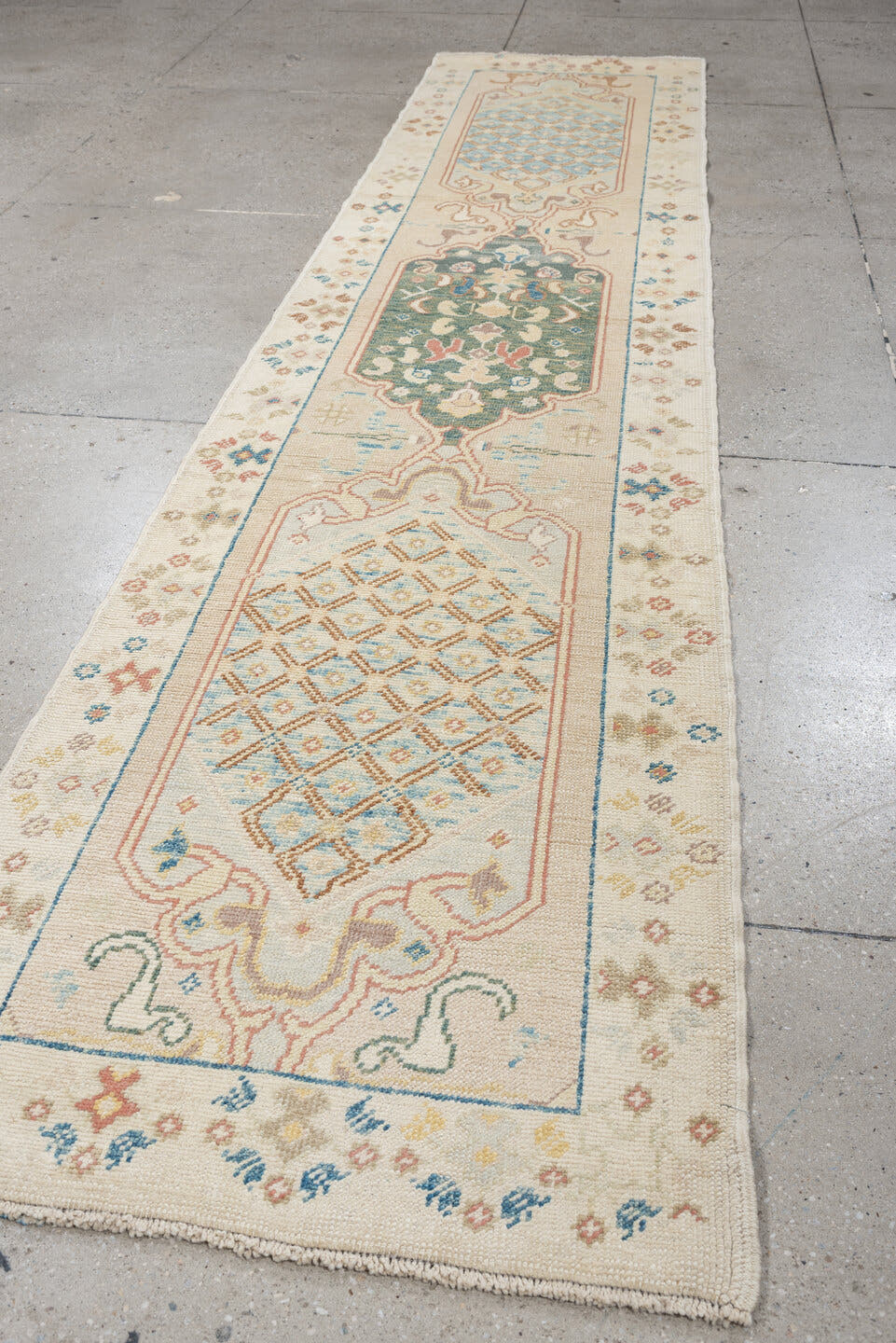 2' x 12' one-of-a-kind handmade vintage Oushak runner rug. Color palette: ivory, turquoise, sage, coral, tan, rust, taupe