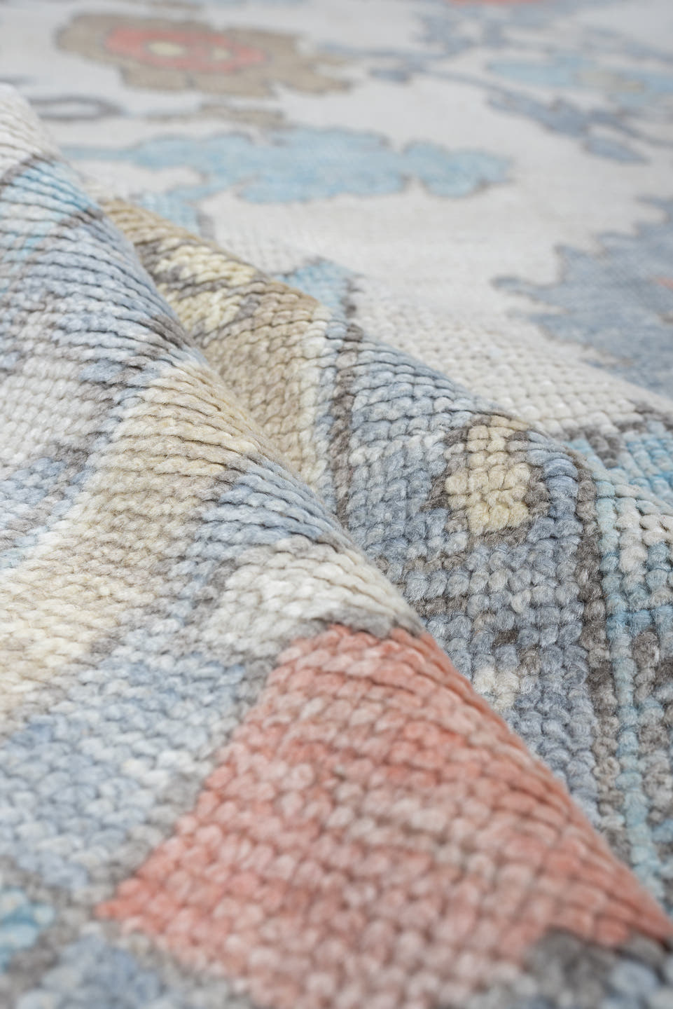 9' x 12' one-of-a-kind handmade vintage Oushak large size rug. Color palette: ivory, powder blue, taupe, coral, pale blue