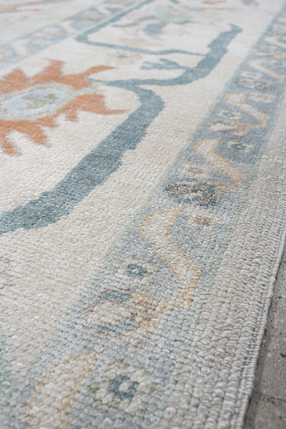 10' x 13' one-of-a-kind handmade vintage Oushak large size rug. Color palette: ivory, powder blue, sage, coral, peach, taupe