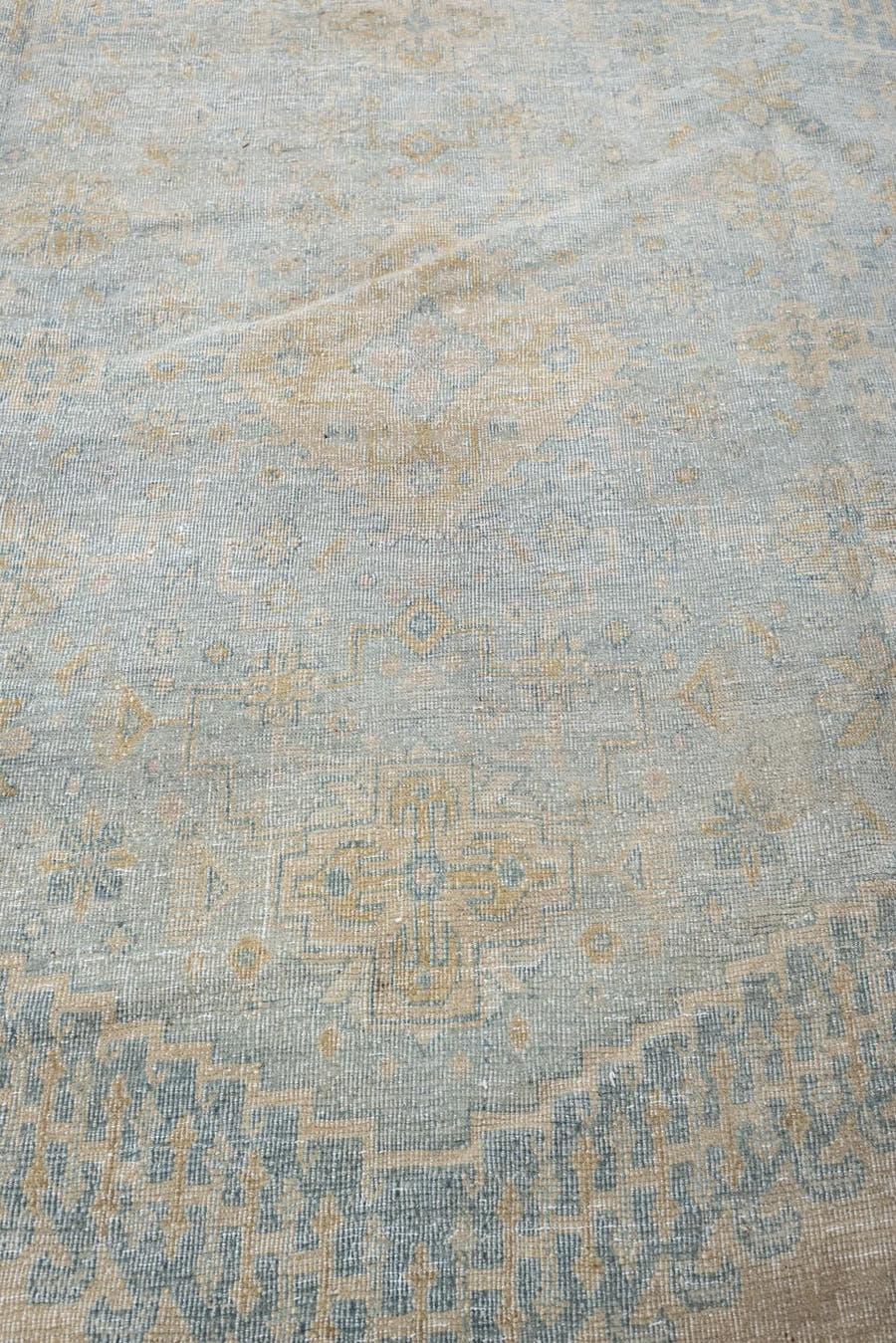 13' x 17' one-of-a-kind handmade antique Veece oversize rug. Color palette: ivory, powder blue, tan, beige, pale gray, taupe
