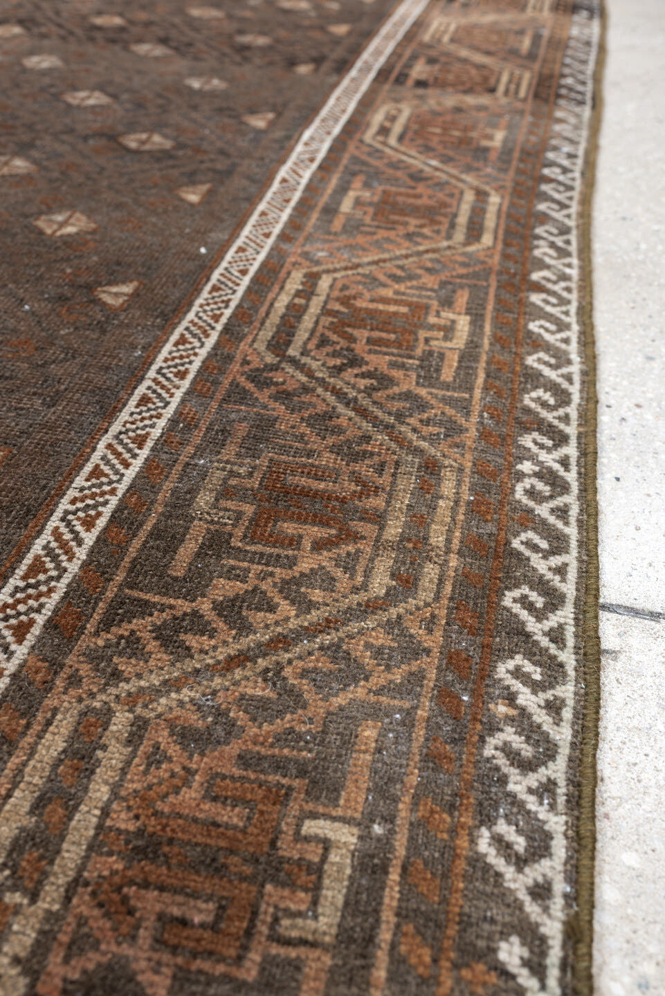 3' x 8' one-of-a-kind handmade antique Belouch runner rug. Color palette: brown, rust, ivory, charcoal, taupe, terracotta