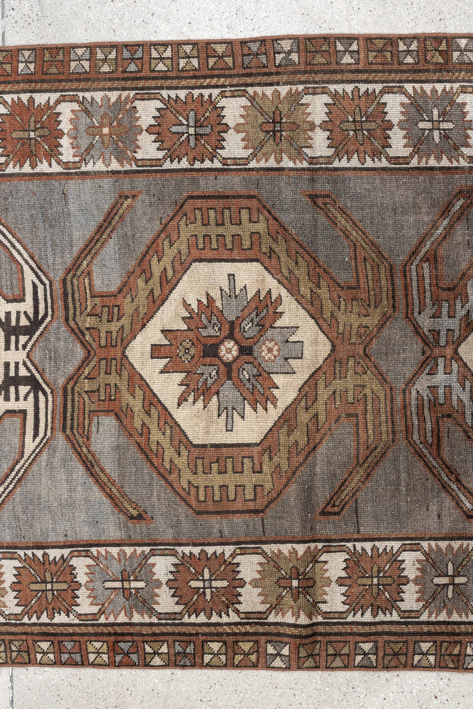 3' x 7' one-of-a-kind handmade antique Caucasian runner rug. Color palette: charcoal, ivory, rust, taupe, dark brown, camel
