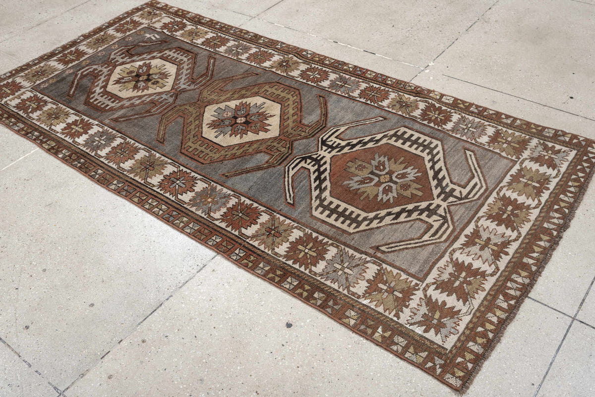 3' x 7' one-of-a-kind handmade antique Caucasian runner rug. Color palette: charcoal, ivory, rust, taupe, dark brown, camel