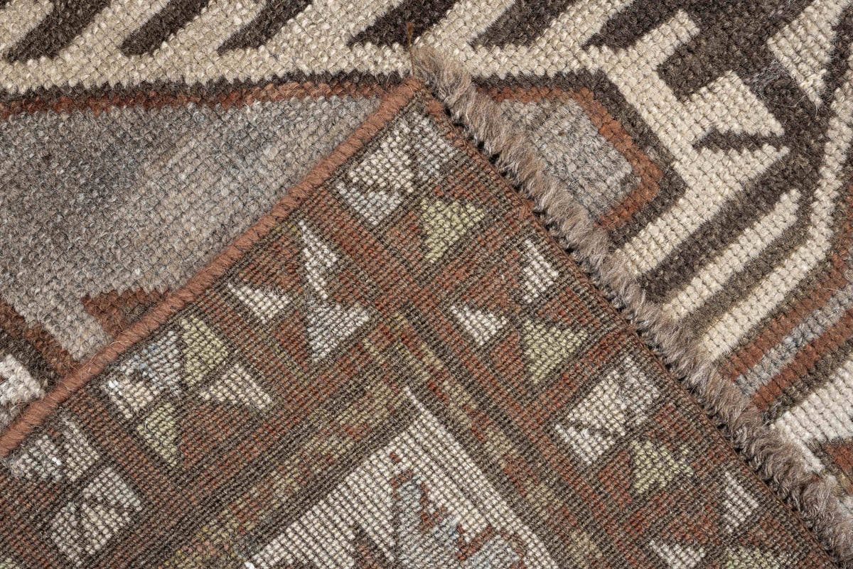 3' x 7' one-of-a-kind handmade antique Caucasian runner rug. Color palette: charcoal, ivory, rust, taupe, dark brown, camel