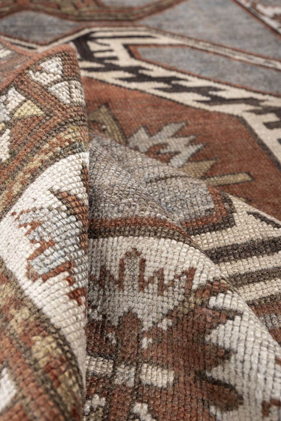 3' x 7' one-of-a-kind handmade antique Caucasian runner rug. Color palette: charcoal, ivory, rust, taupe, dark brown, camel