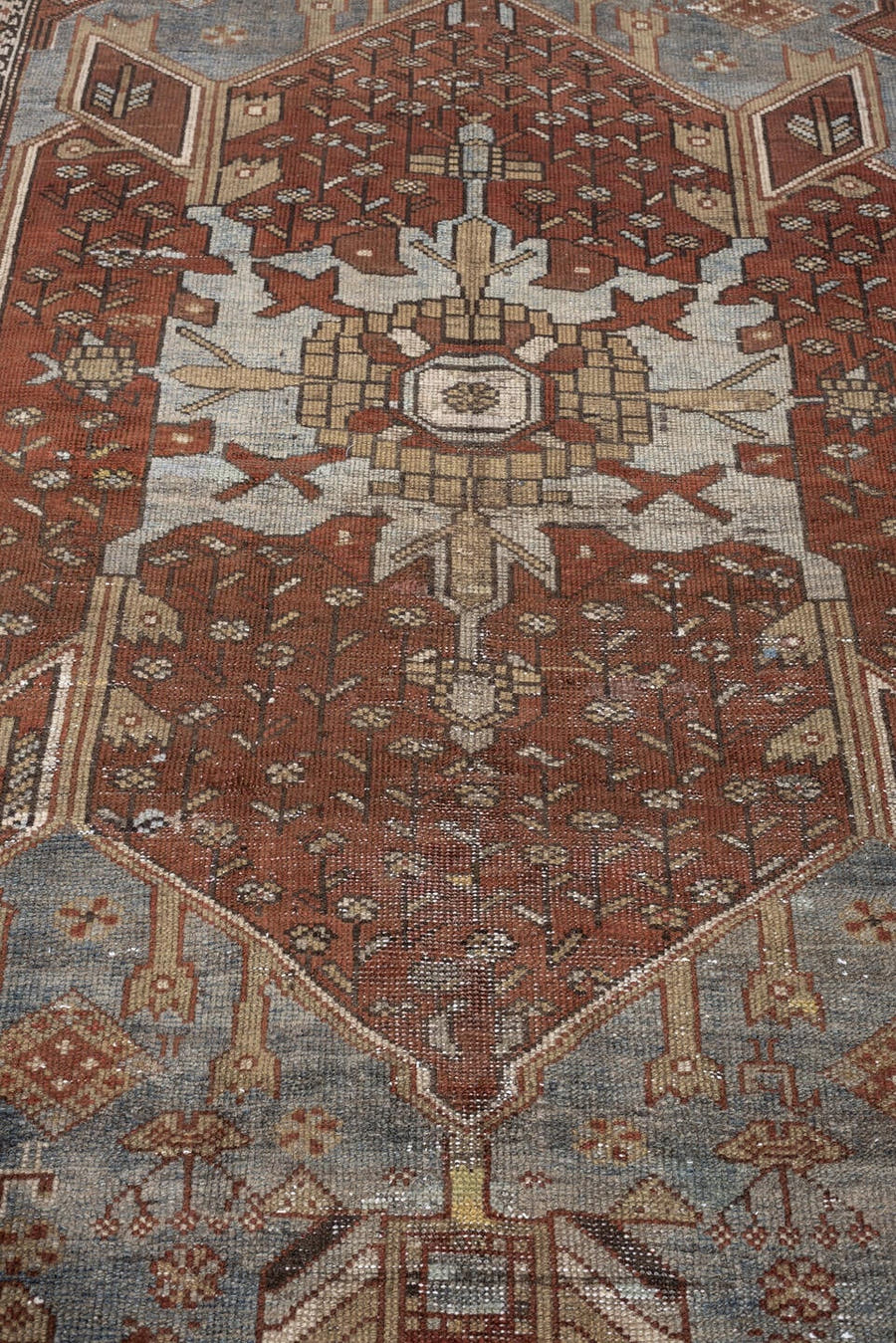 3' x 8' one-of-a-kind handmade antique Kurd runner rug. Color palette: rust, slate blue, ivory, terracotta, charcoal, taupe