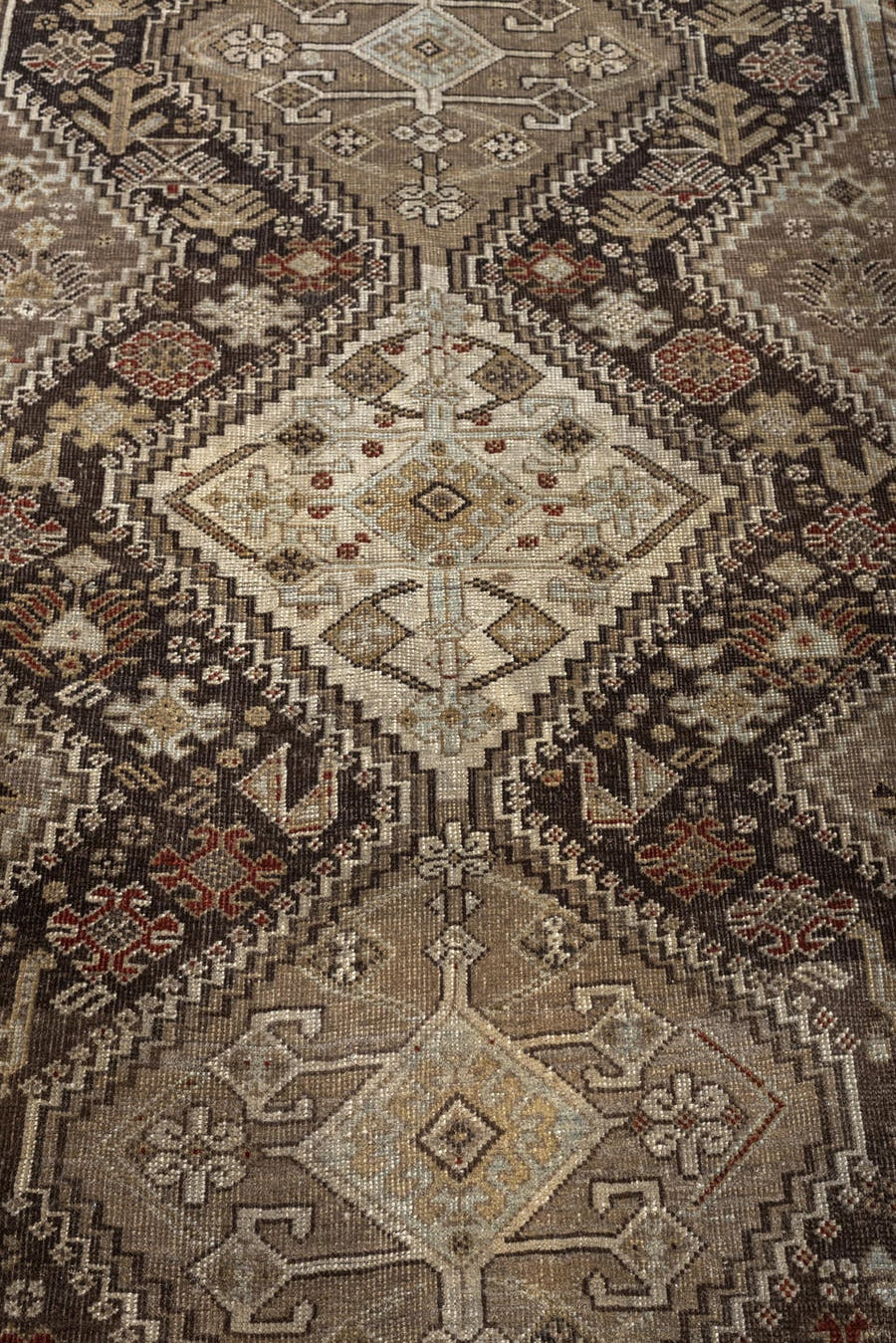 3' x 5' one-of-a-kind handmade antique Shiraz small size rug. Color palette: taupe, charcoal, ivory, camel, brown, rust