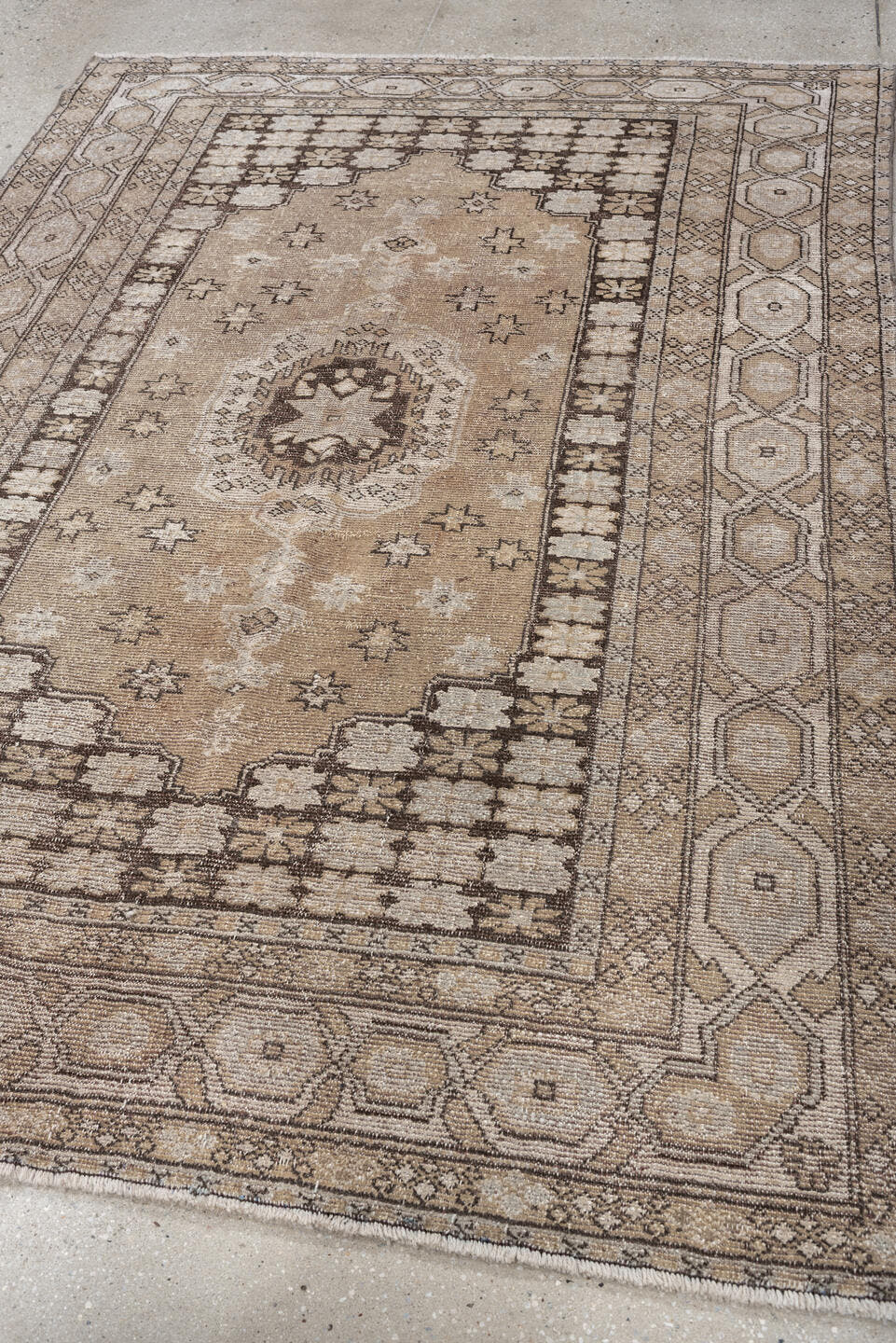 5' x 7' one-of-a-kind handmade antique Kurd rug. Color palette: taupe, ivory, charcoal, camel, beige, brown, gray, black