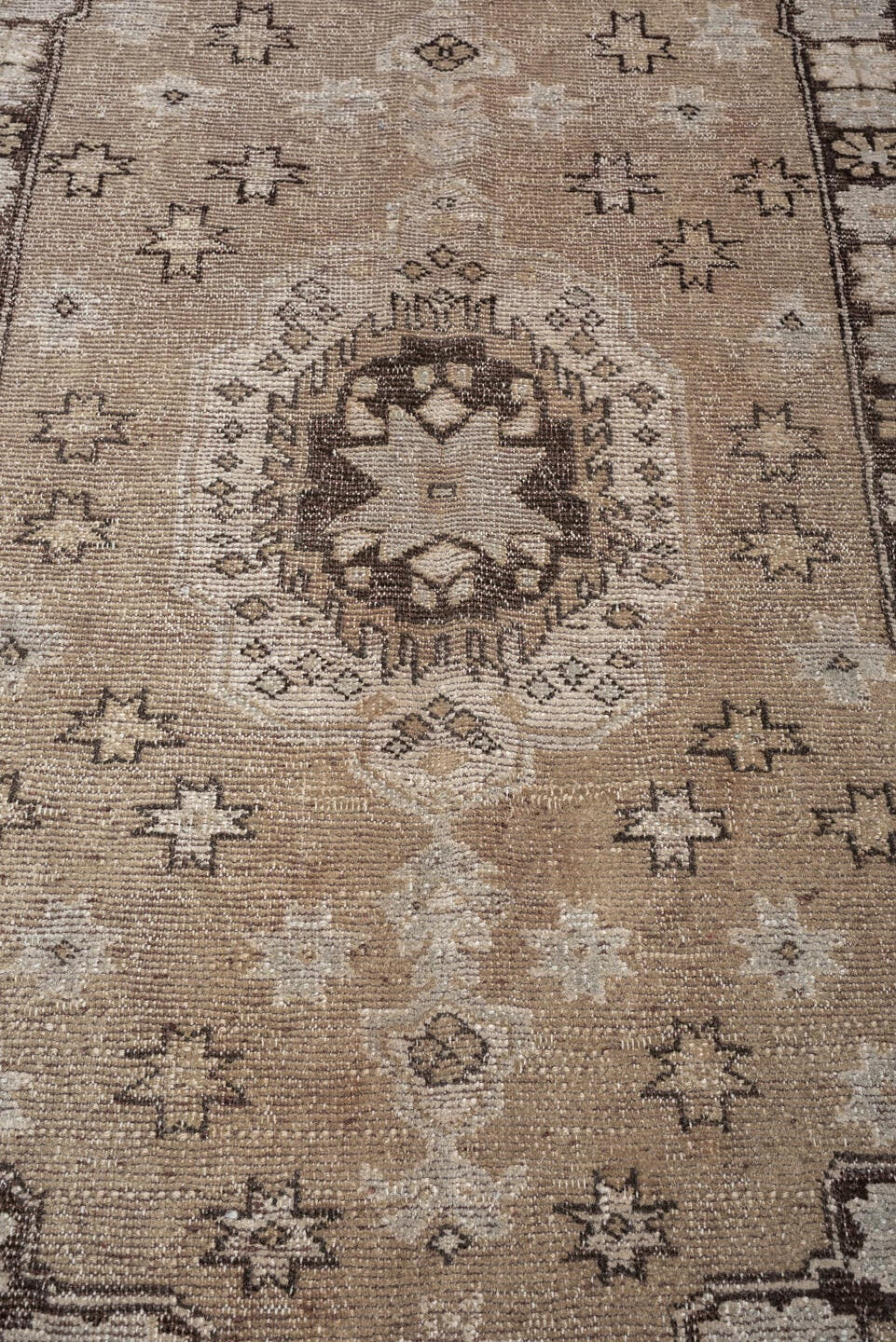 5' x 7' one-of-a-kind handmade antique Kurd rug. Color palette: taupe, ivory, charcoal, camel, beige, brown, gray, black
