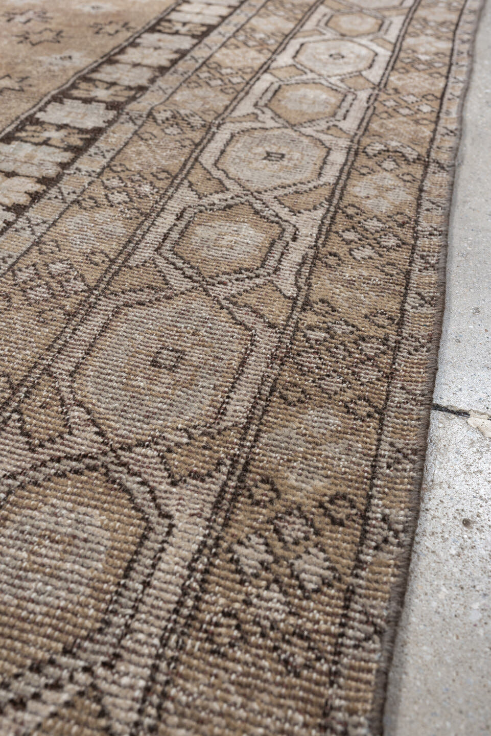 5' x 7' one-of-a-kind handmade antique Kurd rug. Color palette: taupe, ivory, charcoal, camel, beige, brown, gray, black