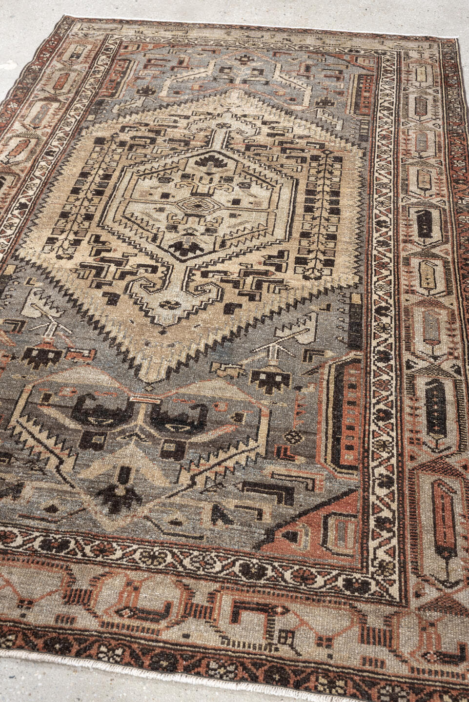 4' x 6' one-of-a-kind handmade antique Hamadan rug. Color palette: ivory, slate blue, charcoal, terracotta, taupe, ebony