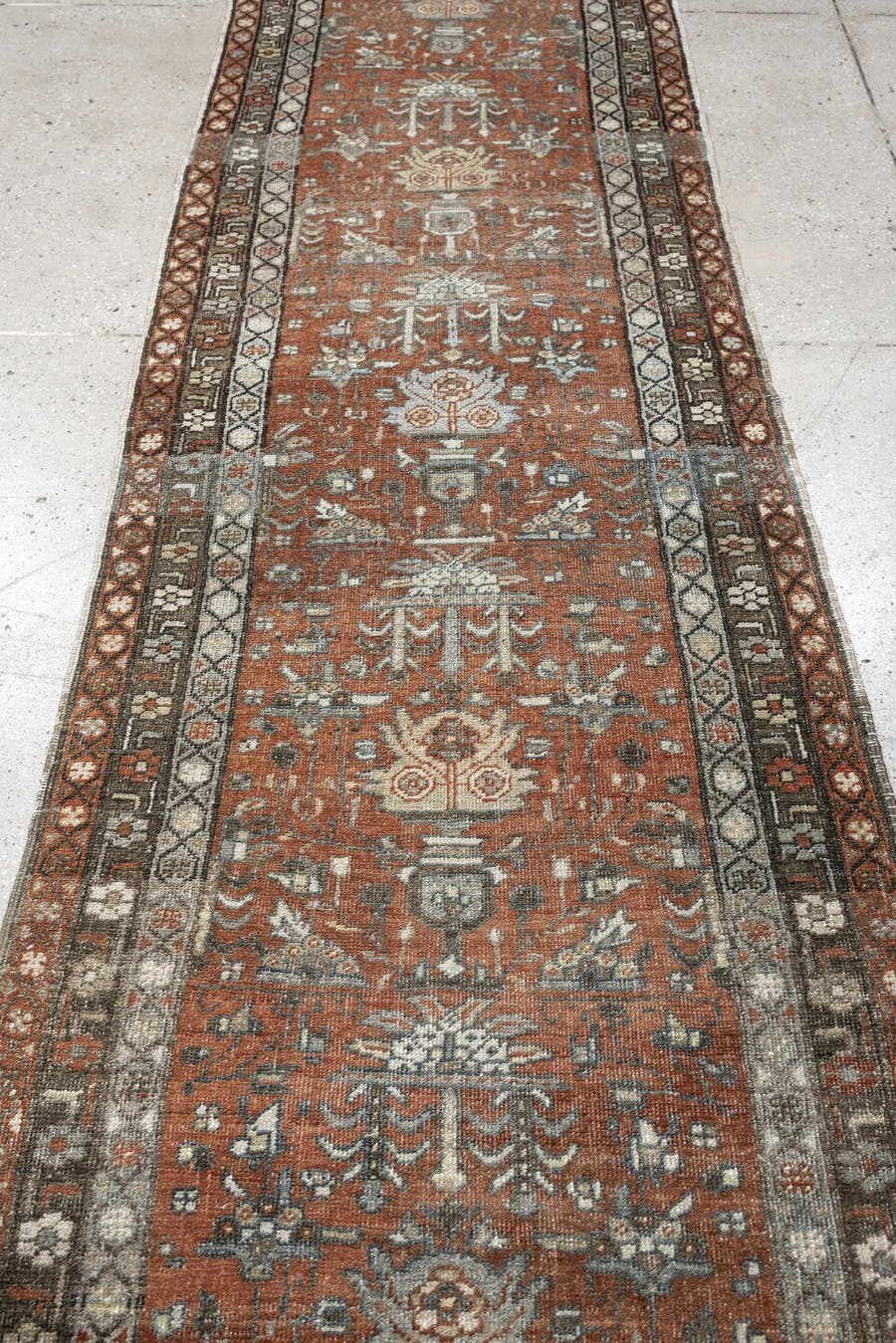2' x 10' one-of-a-kind handmade antique Heriz runner rug. Color palette: rust, terra cotta, charcoal, ivory, slate blue