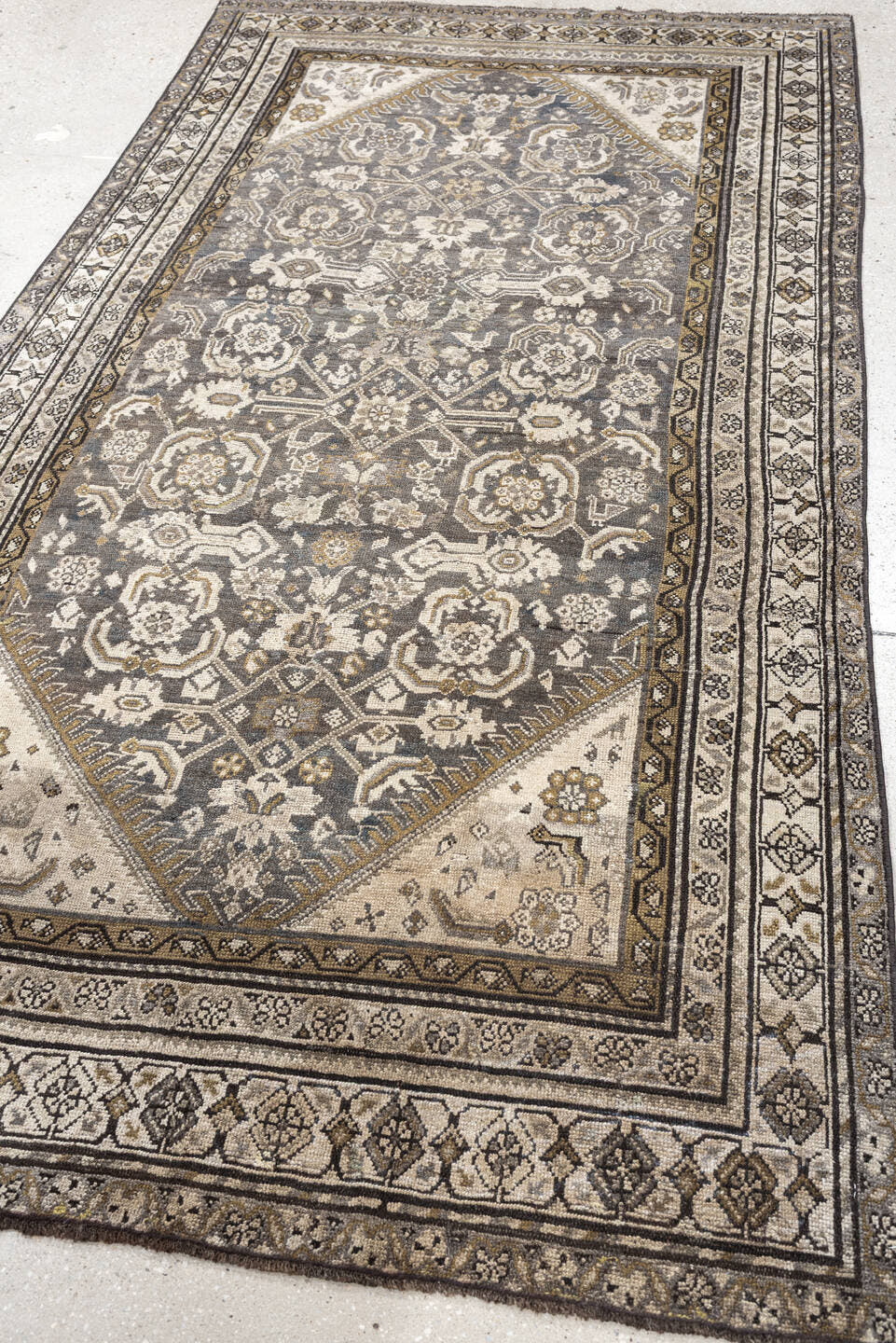 4' x 7' one-of-a-kind handmade antique Malayer rug. Color palette: charcoal, ivory, taupe, ochre, camel, ebony, slate, black