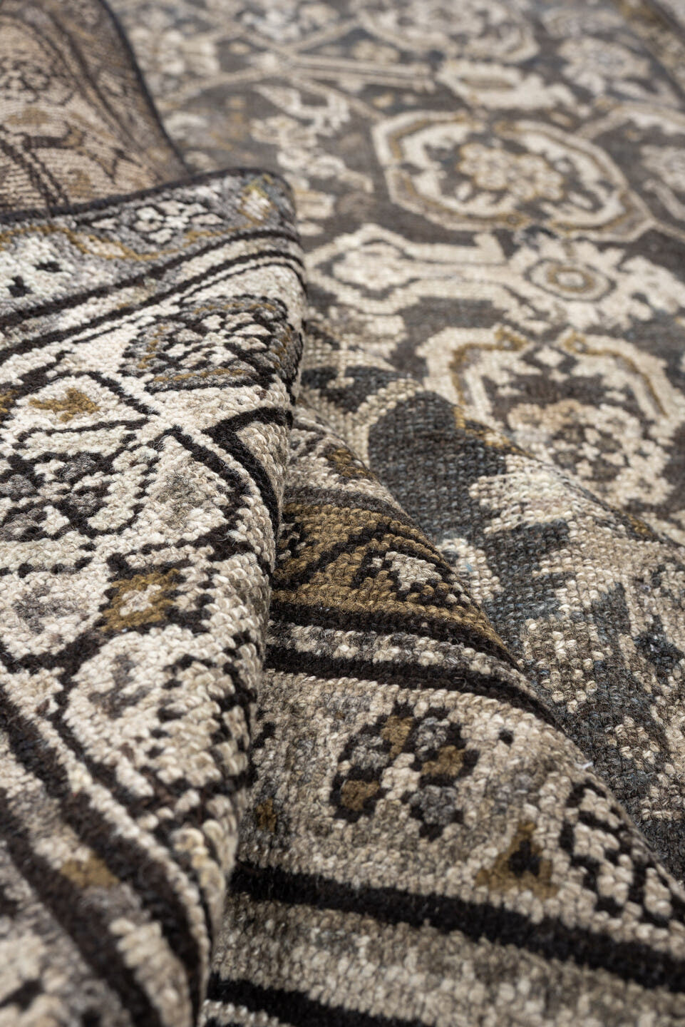 4' x 7' one-of-a-kind handmade antique Malayer rug. Color palette: charcoal, ivory, taupe, ochre, camel, ebony, slate, black