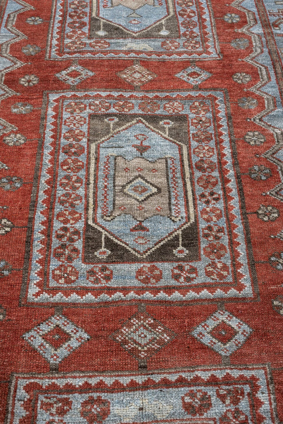 3' x 9' one-of-a-kind handmade antique Kurd runner rug. Color palette: terracotta, blue gray, ivory, charcoal, rust, taupe