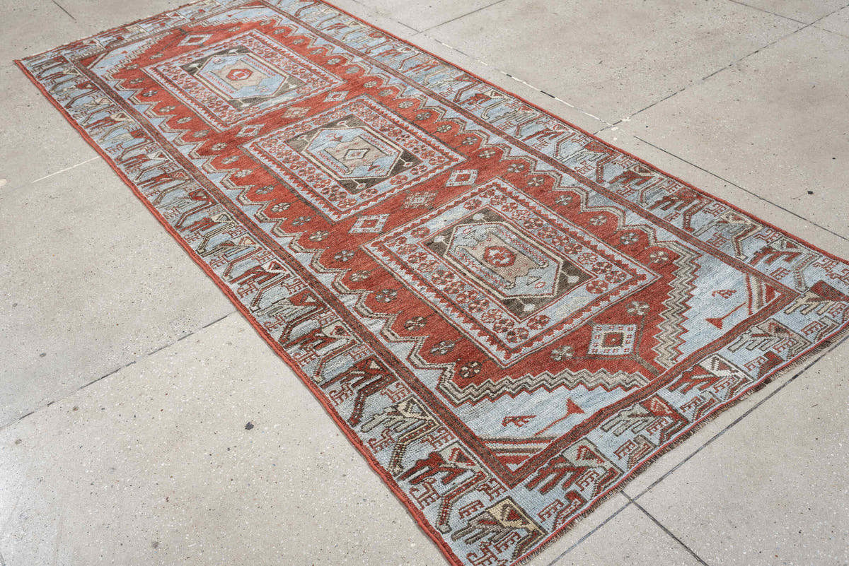 3' x 9' one-of-a-kind handmade antique Kurd runner rug. Color palette: terracotta, blue gray, ivory, charcoal, rust, taupe