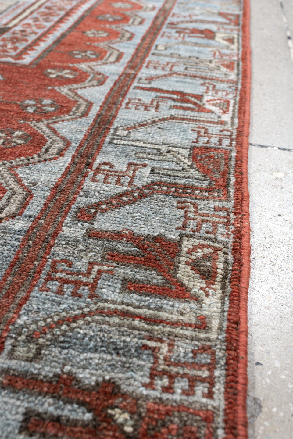 3' x 9' one-of-a-kind handmade antique Kurd runner rug. Color palette: terracotta, blue gray, ivory, charcoal, rust, taupe