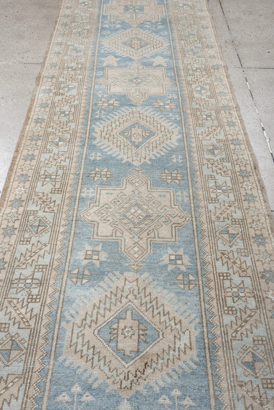 3' x 11' one-of-a-kind handmade antique Heriz runner rug. Color palette: sky blue, ivory, taupe, beige, camel, slate, brown