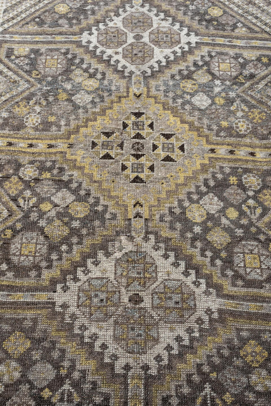4' x 5' one-of-a-kind handmade antique Shiraz small size rug. Color palette: taupe, charcoal, ivory, soft gold, gray, brown